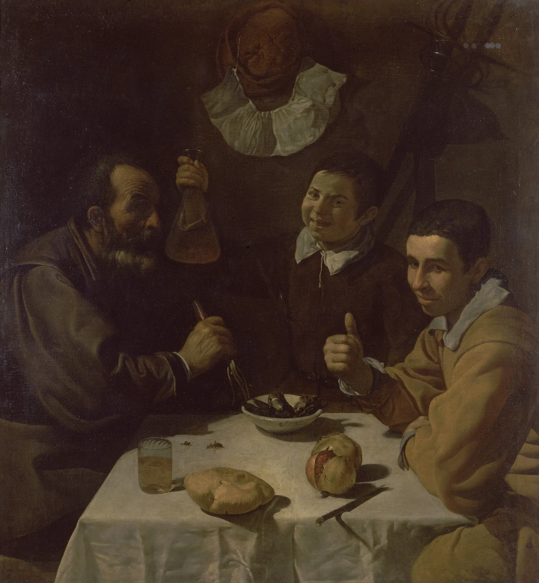 The Lunch The Lunch by Diego Velázquez. Three men of varying ages sit around a table laid with a white cloth, bread, and pomegranate, engaging in a lively meal.
