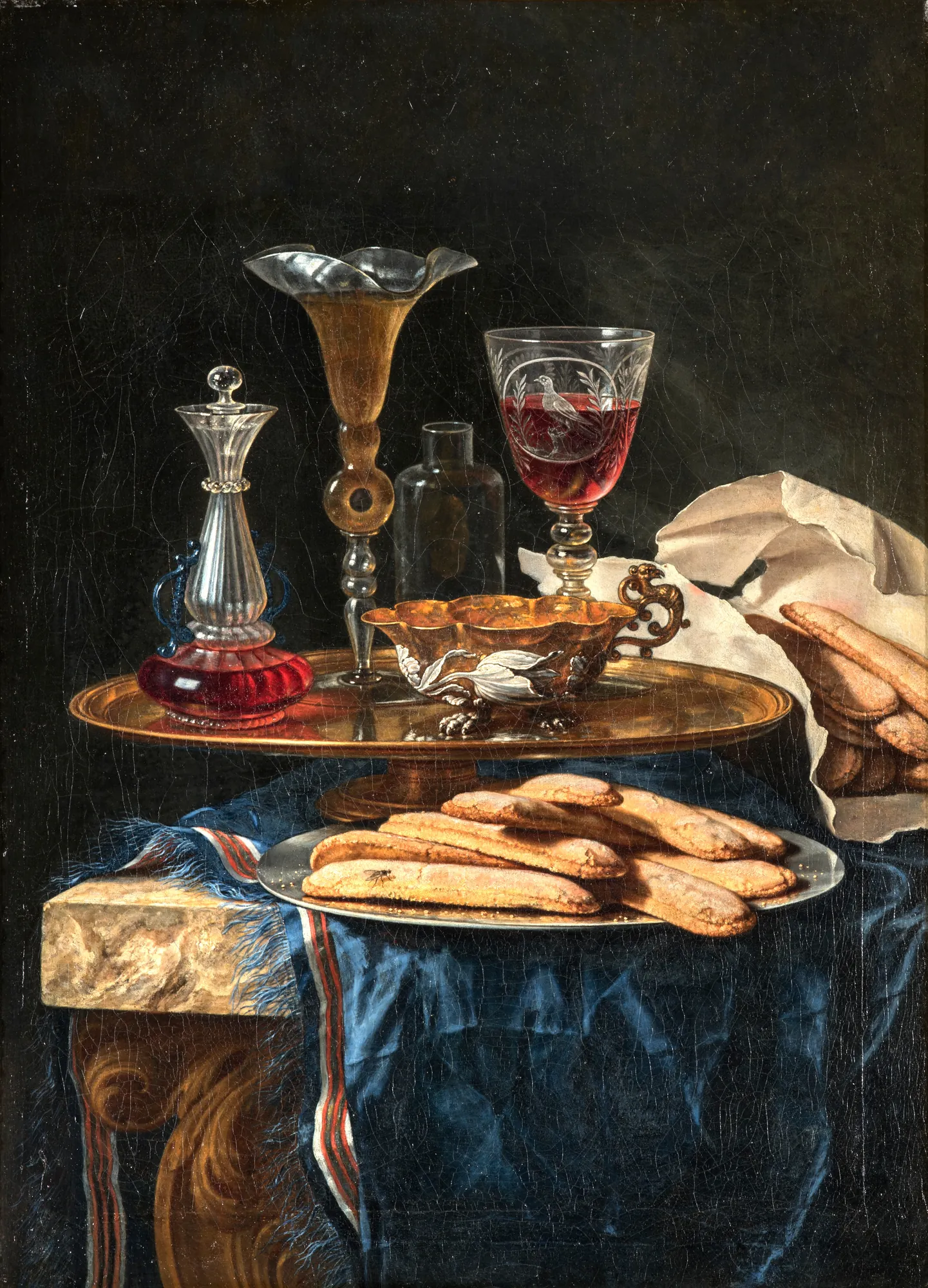 Still Life with Ladyfingers Still Life with Ladyfingers by Christian Berentz. An elegant 18th-century still life featuring assorted glassware, a gilded bowl, and ladyfinger biscuits on a blue fringed tablecloth against a dark background.