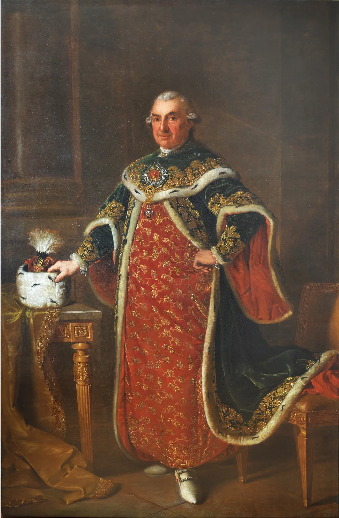 Portrait of Samuel von Brukenthal Portrait of Samuel von Brukenthal by Georg Weikert. A full-length portrait of a man in ornate red and green robes trimmed with ermine fur, standing beside a small table.