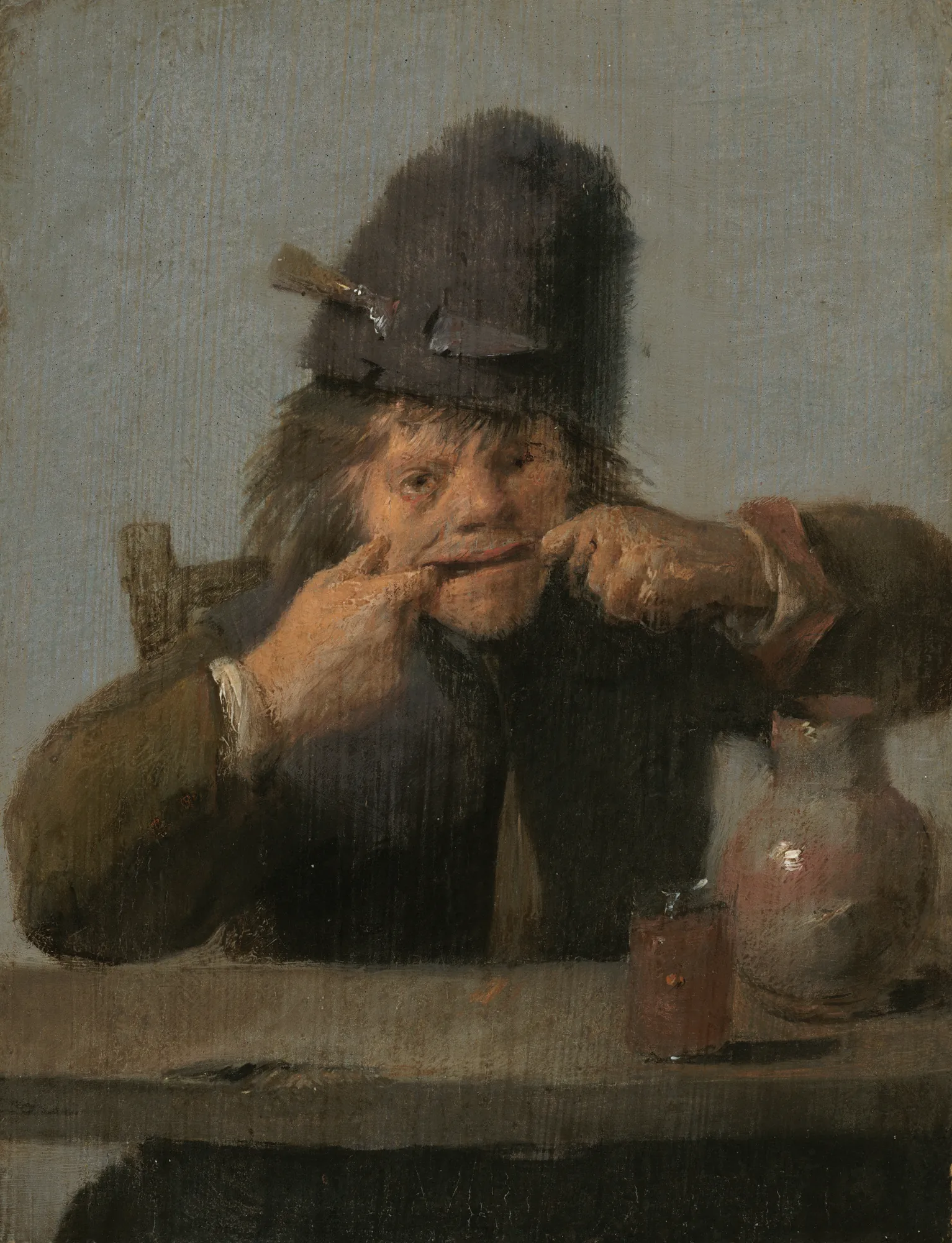Youth Making a Face Youth Making a Face by Adriaen Brouwer. A young man wearing a tall dark hat pulls at the corners of his mouth while sitting at a table with a glass and pitcher.