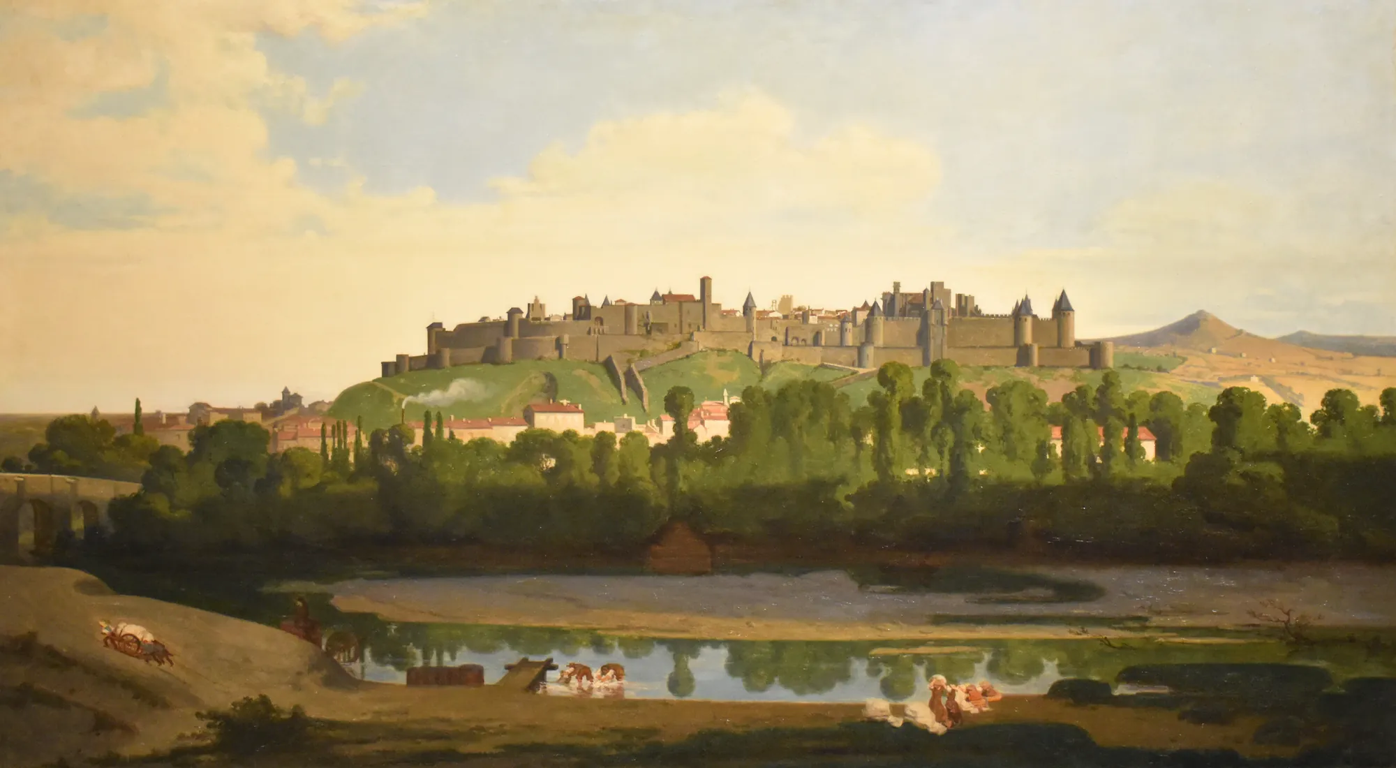 La Cité de Carcassonne La Cité de Carcassonne by Jean Jalabert. A panoramic oil painting depicting the fortified medieval city of Carcassonne atop a lush green hill, overlooking a river where figures and animals gather.