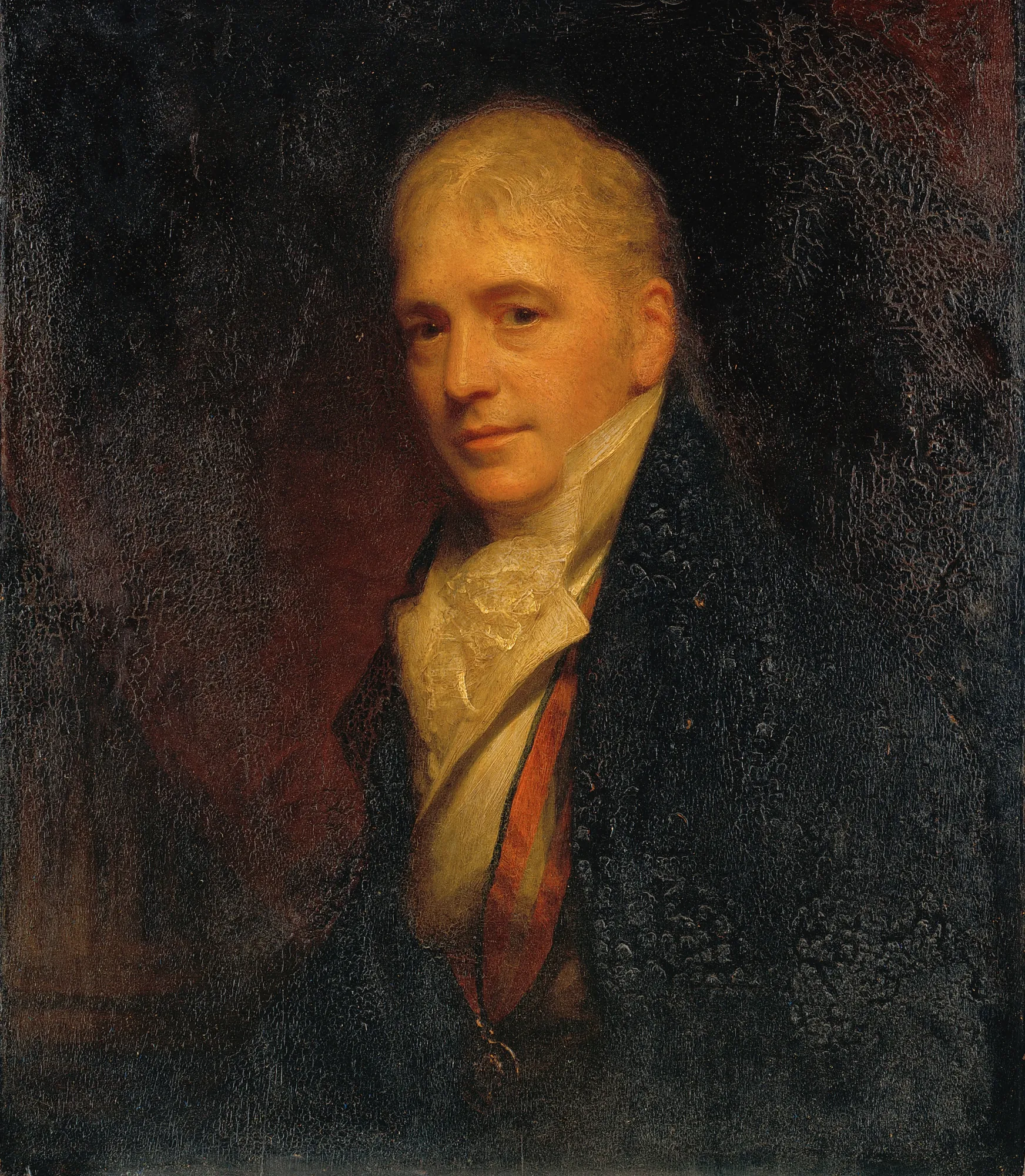 Sir Francis Bourgeois Sir Francis Bourgeois by William Beechey. A half-length portrait of a man with fair hair, wearing a high-collared white cravat and a dark overcoat against a dark, atmospheric background.