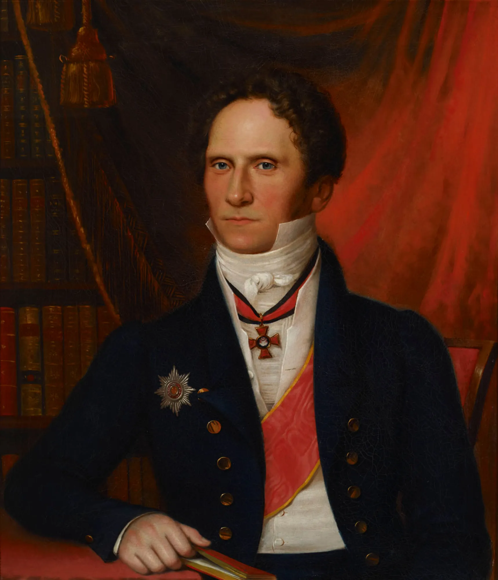 Portrait of Baron Carl Johan Walleen Portrait of Baron Carl Johan Walleen by Johan Erik Lindh. A half-length portrait of a man in a dark blue military-style coat with a red sash and medals, seated before a bookshelf and a red curtain.