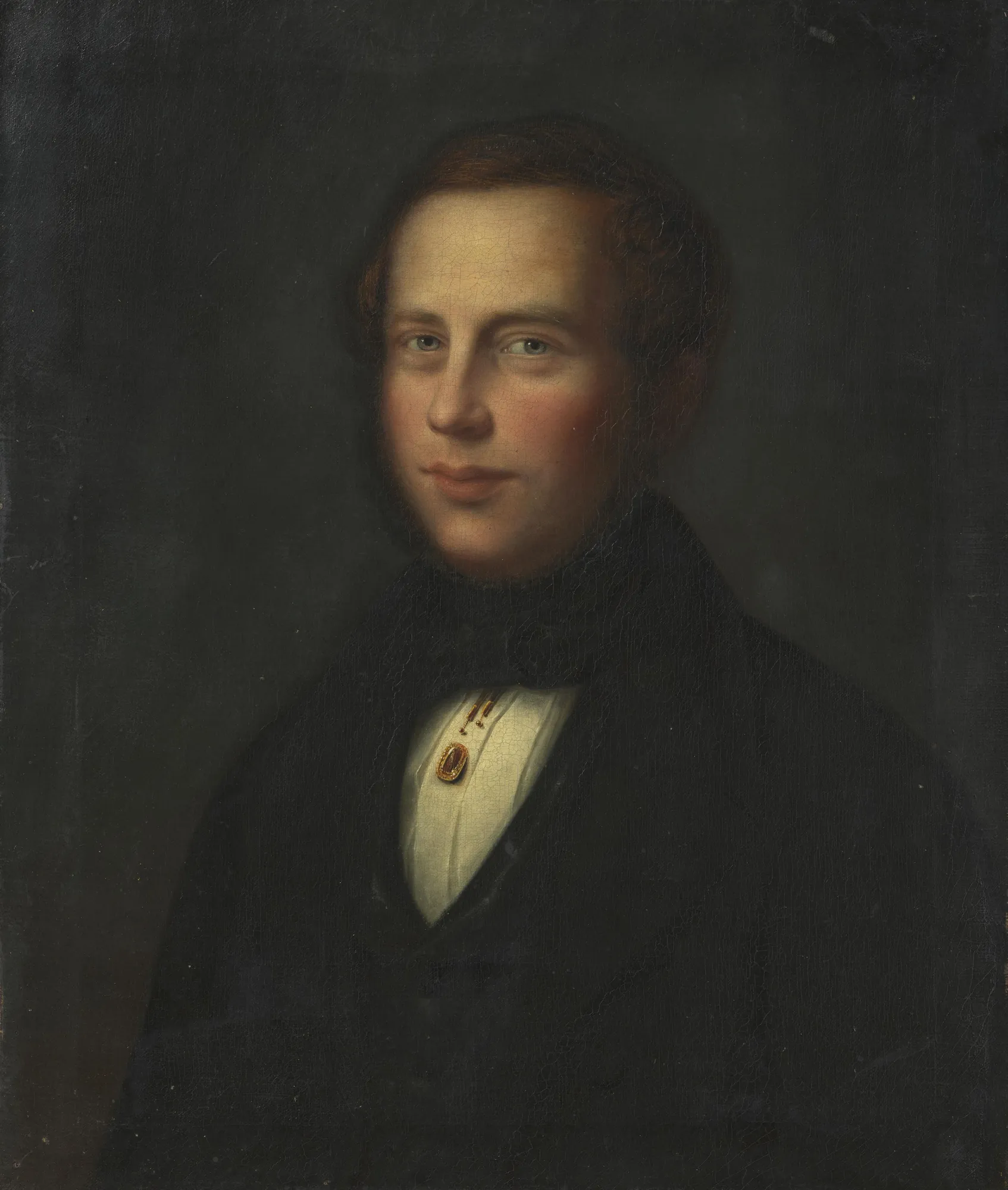 Fritz Heinrich Frølich Fritz Heinrich Frølich by Carl Peter Lehmann. A half-length oil portrait of a young man with reddish-brown hair dressed in dark formal attire against a moody, shadowed background.