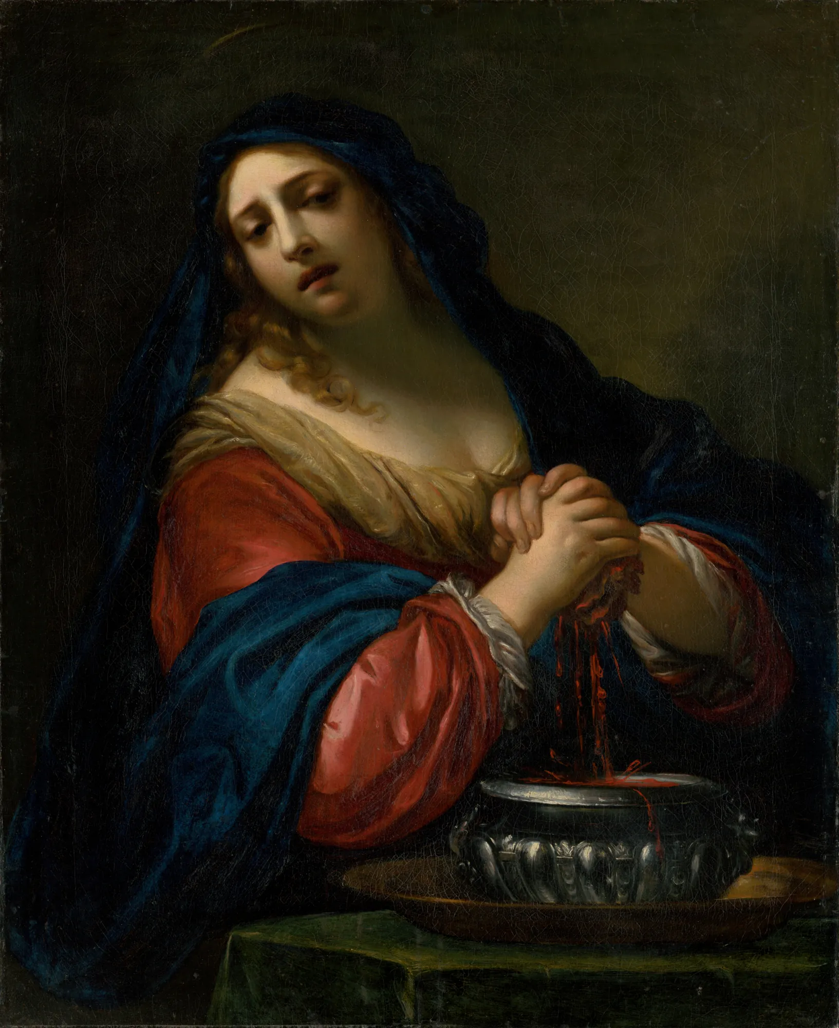 Saint Praxedis Saint Praxedis by Simone Pignoni. A woman in a vibrant red dress and deep blue veil squeezes blood from a sponge into an ornate silver basin against a dark background.