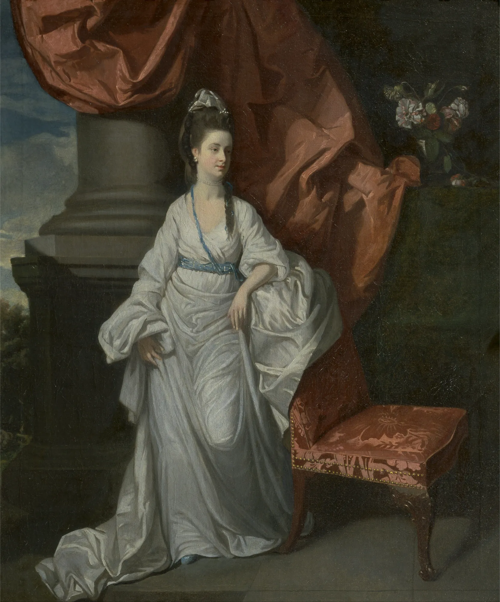 Lady Jean Grant Lady Jean Grant by Henry Walton. A full-length 18th-century portrait of a woman in an elegant white gown, leaning against a classical stone column next to a red upholstered chair.