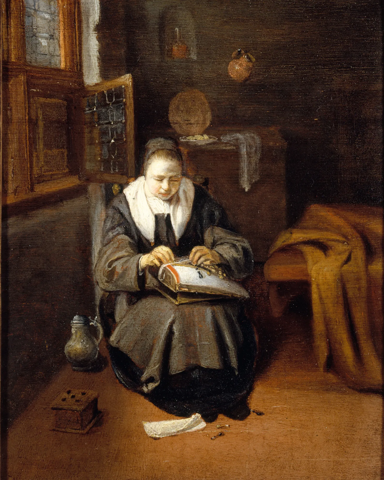 A Lacemaker A Lacemaker by Nicolaes Maes. An interior scene depicts a woman in traditional 17th-century attire seated and intently focused on her lacemaking work.