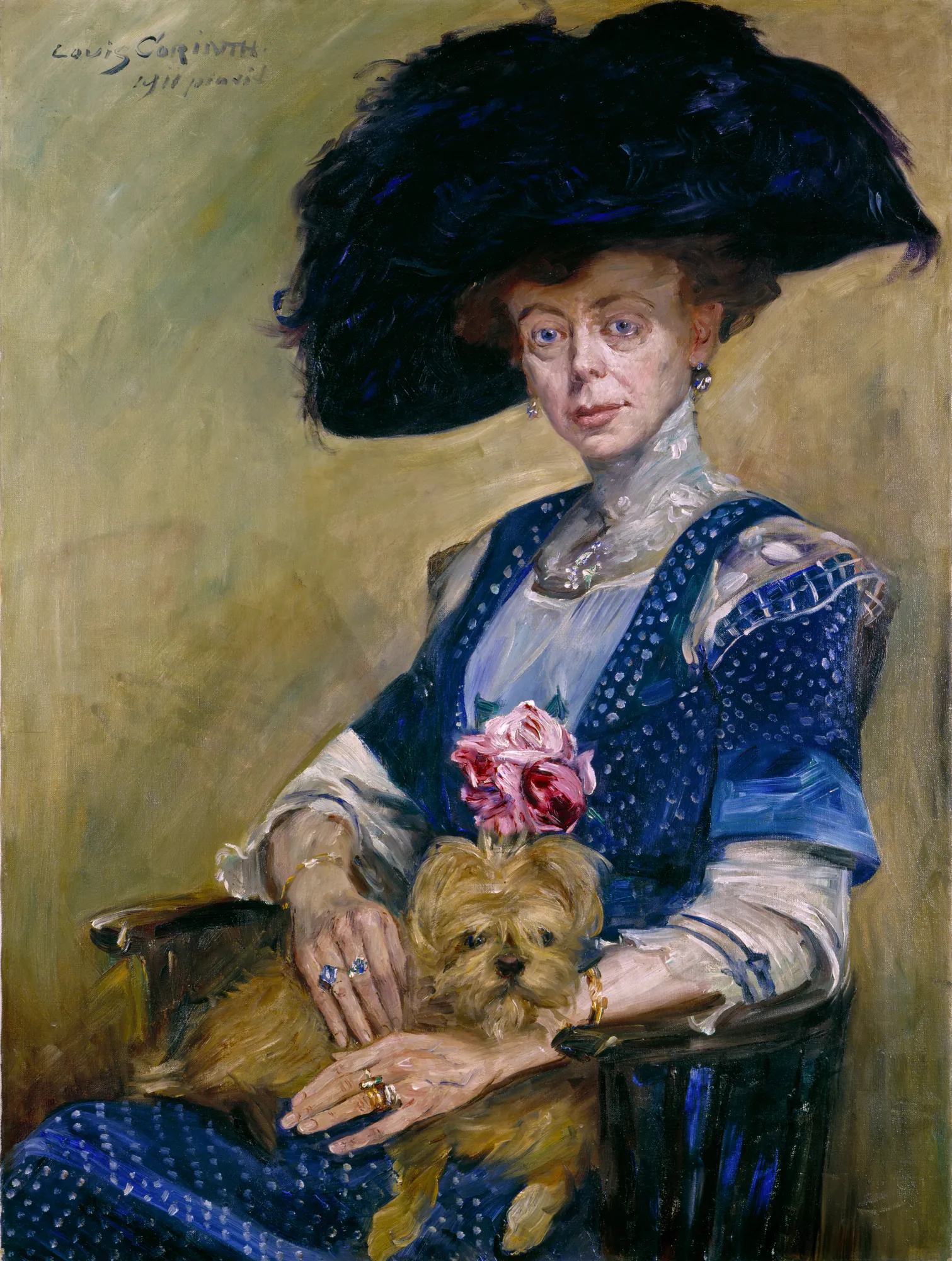 Lady Luther Lady Luther by Lovis Corinth. An oil portrait of a woman in an elegant blue dress and a large black feathered hat, seated and cradling a small brown terrier.