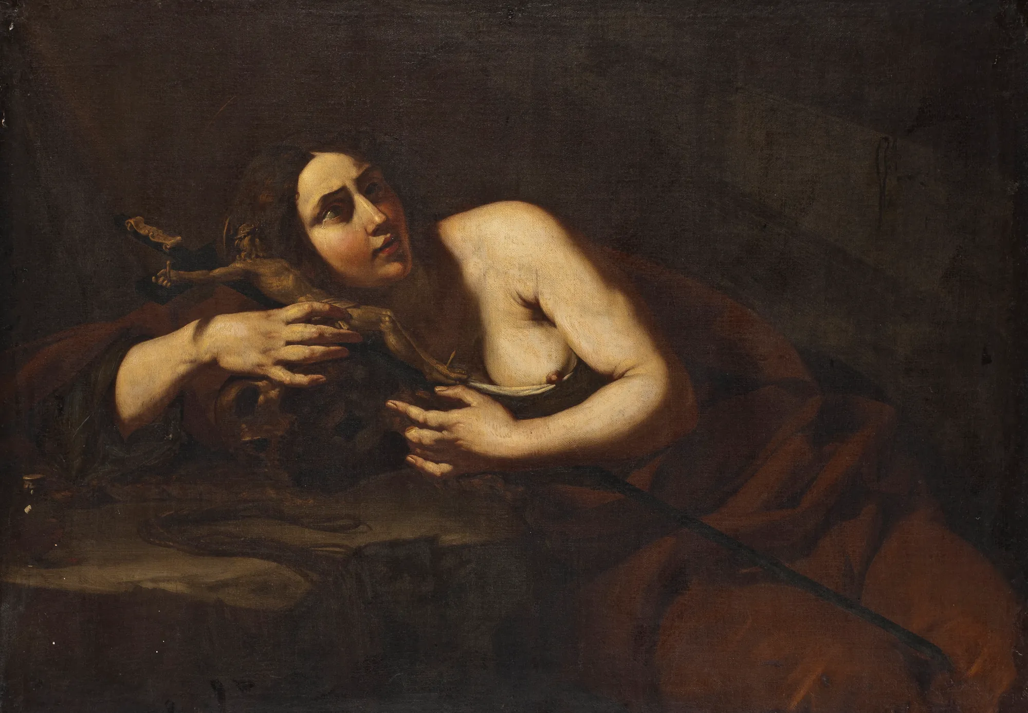 The Penitent Magdalen The Penitent Magdalen by Cecco del Caravaggio. A dramatic Baroque painting of Mary Magdalene leaning contemplatively over a crucifix and a skull in a dark, shadowed environment.