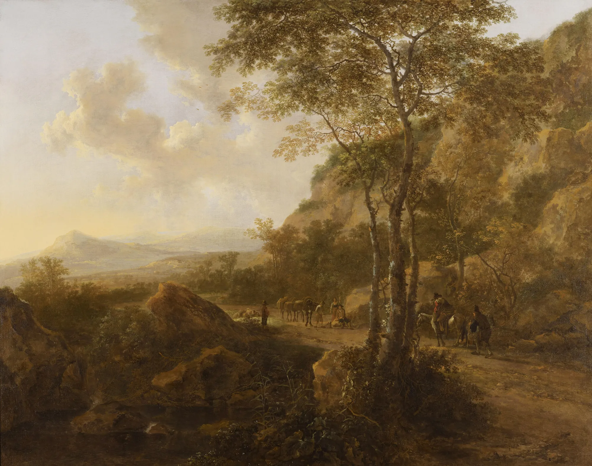 Landscape with Three Tall Oaks and Travellers Landscape with Three Tall Oaks and Travellers by Jan Both. A golden-toned landscape featuring travellers and pack animals on a rocky path beneath tall, airy oak trees, with distant hazy mountains under a soft sky.