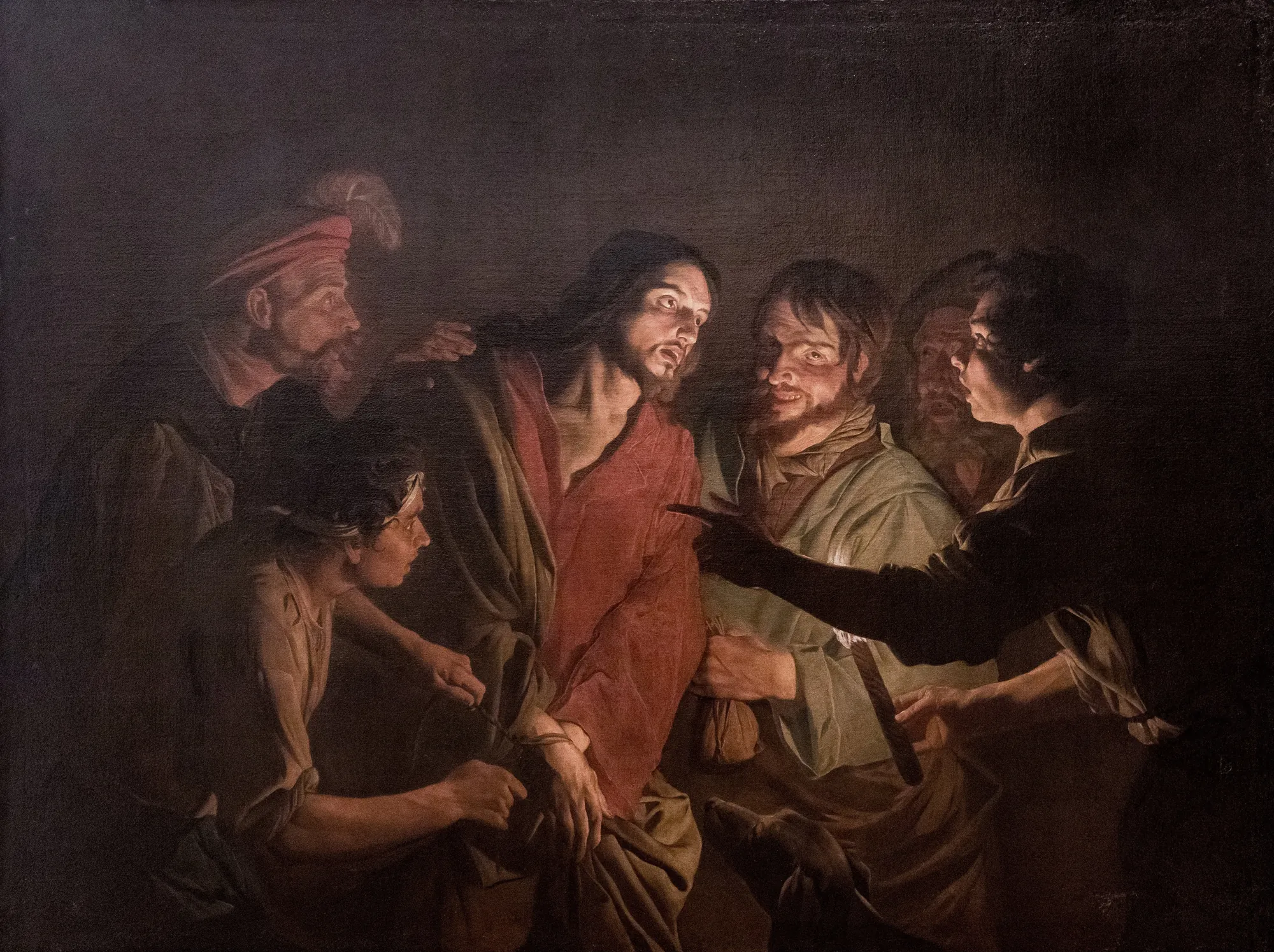 The Taking of Christ The Taking of Christ by Jacques de l'Ange. A dramatic scene illuminated by a single light source showing several figures surrounding a man in a red robe.