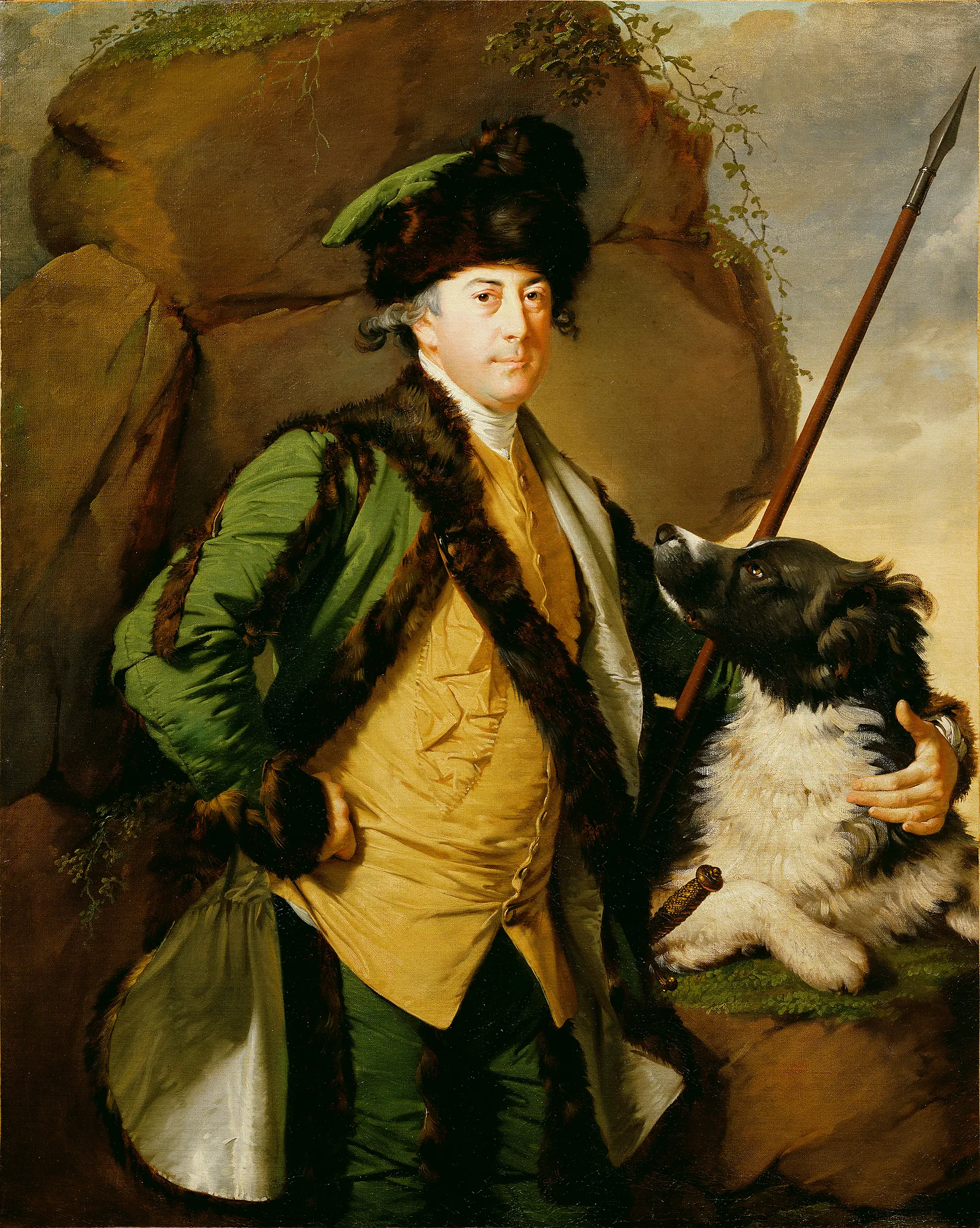 John Whetham of Kirklington John Whetham of Kirklington by Joseph Wright of Derby. An 18th-century portrait of a man in fur-lined hunting attire standing beside a large black and white dog against a rocky backdrop.