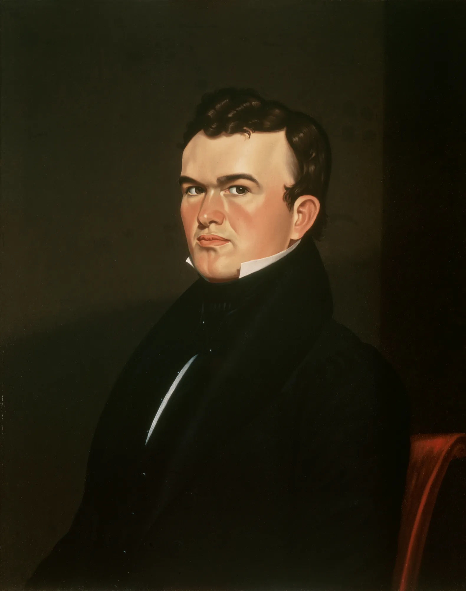 Self Portrait Self Portrait by George Caleb Bingham. A half-length portrait of a young man with dark curly hair, wearing a dark coat and high collar, set against a dark, atmospheric background.