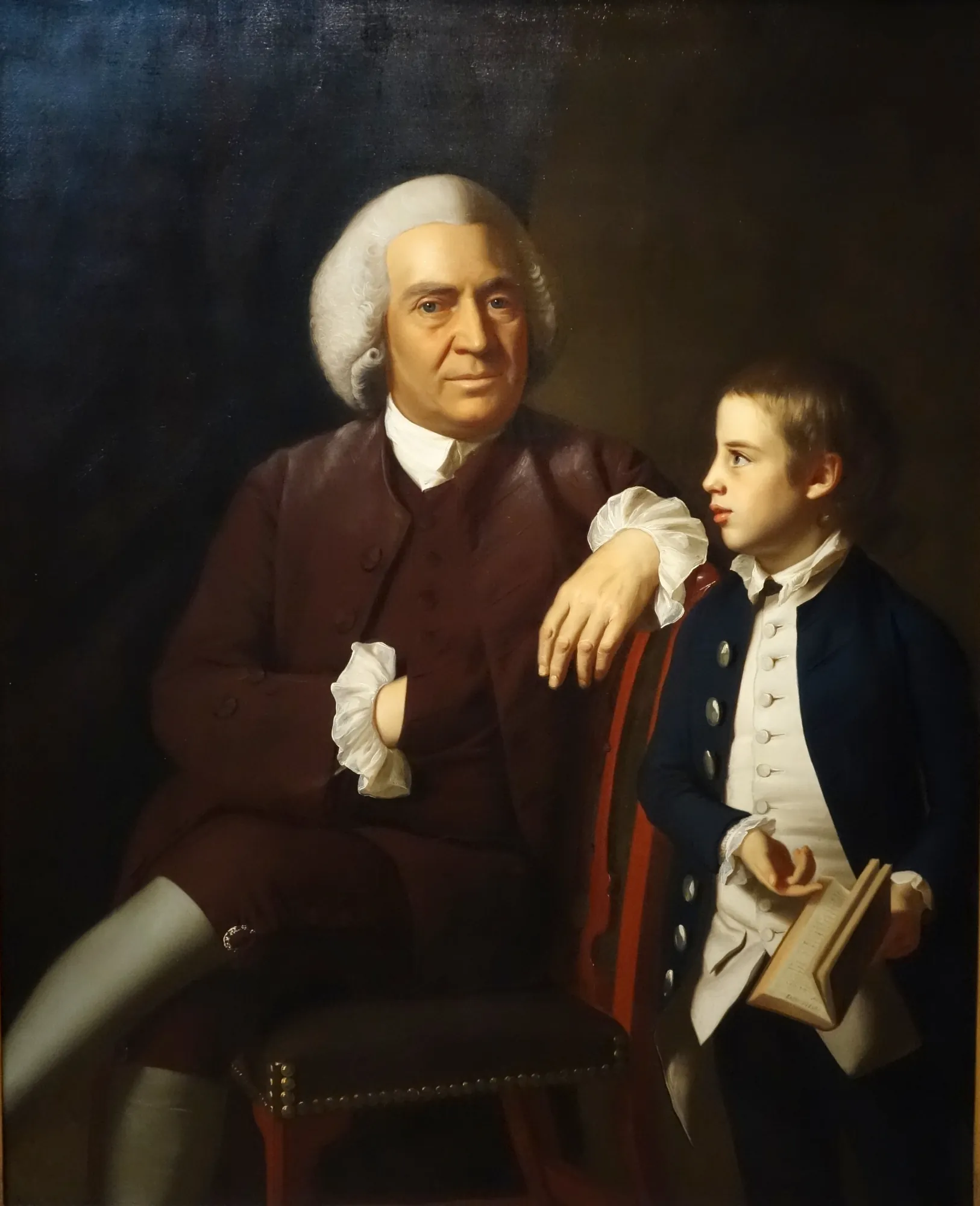 William Vassall and His Son Leonard William Vassall and His Son Leonard by John Singleton Copley. An 18th-century double portrait featuring a seated man in a plum-colored coat beside a young boy holding an open book.