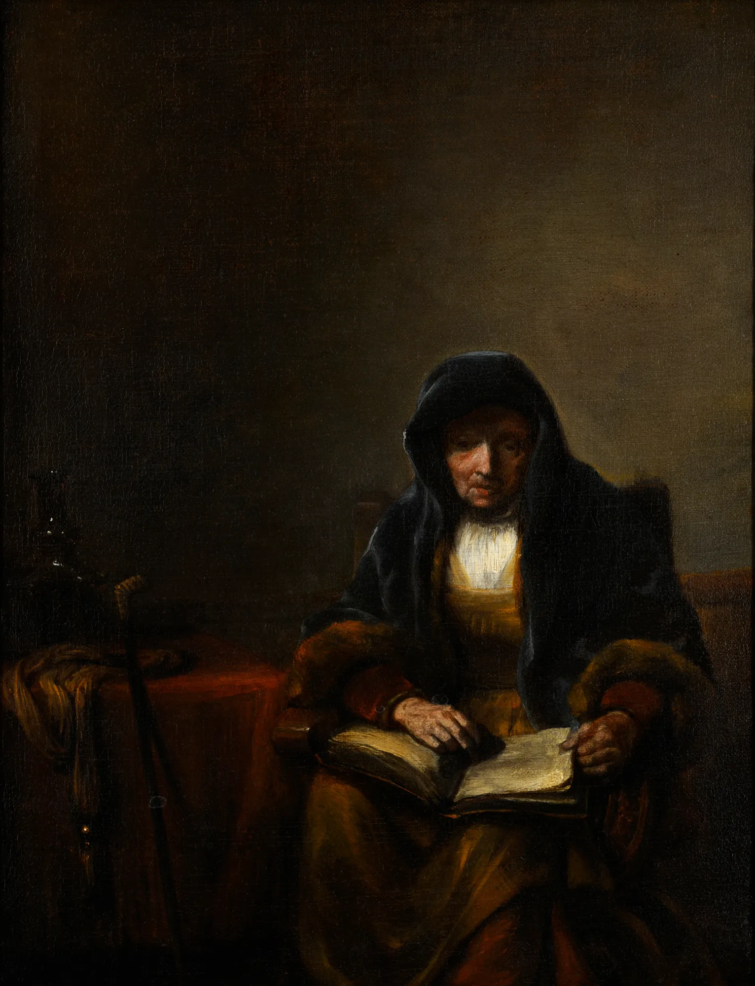 Old Woman with a Book Old Woman with a Book by Abraham van Dijck. An elderly woman in a dark hooded cloak sits in a dimly lit room, intently reading an open book on her lap.