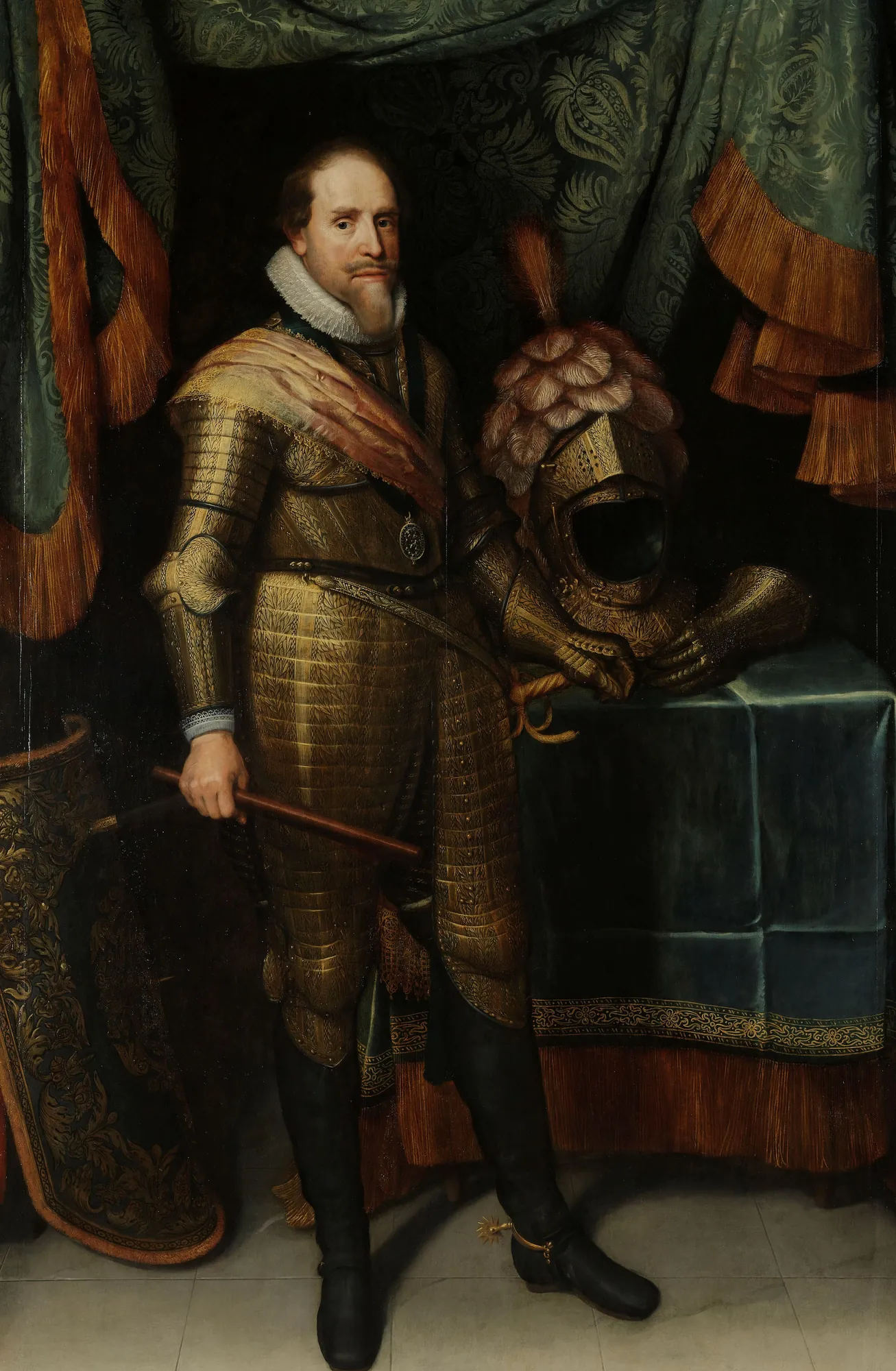 Maurice, Prince of Orange Maurice, Prince of Orange by Michiel Jansz. van Mierevelt. A full-length portrait of a man in ornate gold armor standing beside a plumed helmet on a draped table.