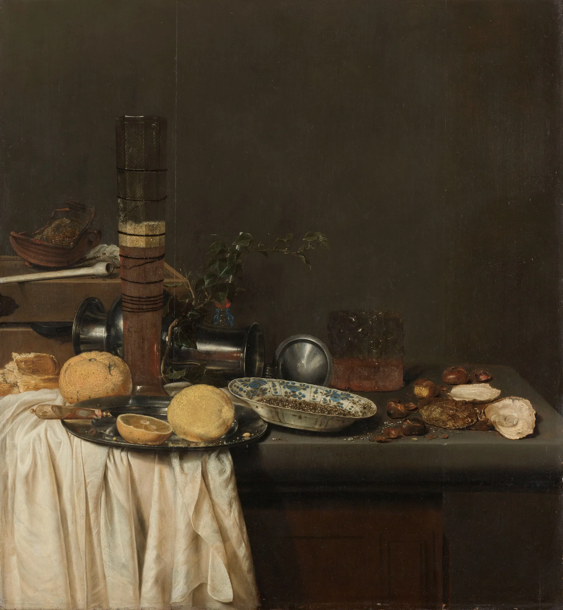 Still Life with a Tall Beer Glass Still Life with a Tall Beer Glass by Jan Jansz van de Velde. A collection of banquet items including a tall ribbed beer glass, lemons, oysters, and pewter vessels arranged on a draped stone table against a dark background.