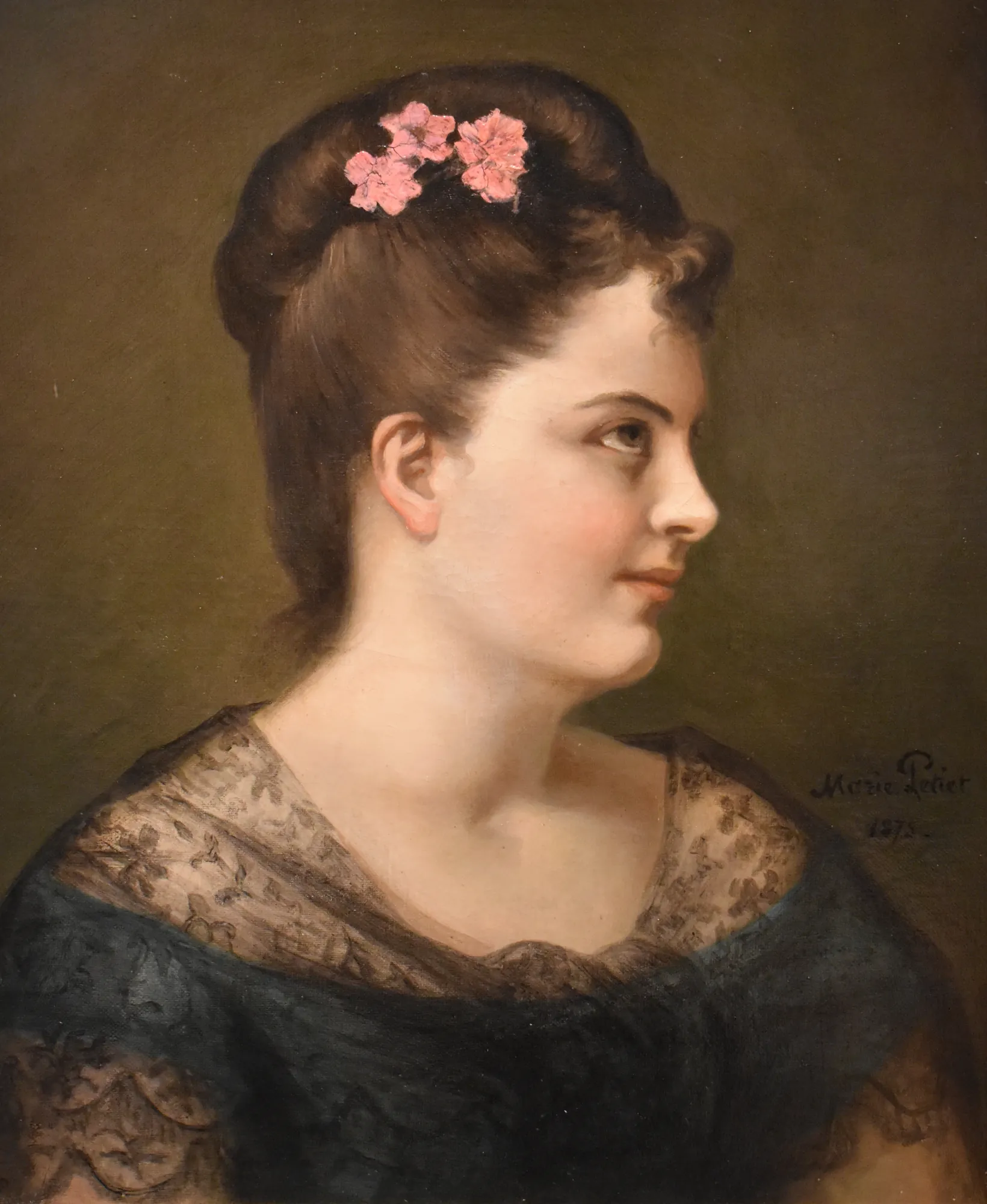 Self-Portrait Self-Portrait by Marie Petiet. A profile portrait of a young woman with pink flowers in her dark hair, wearing a dark garment against a muted green background.