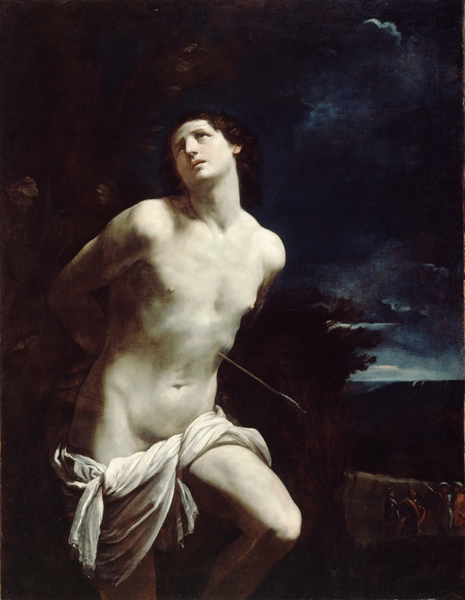 Saint Sebastian Saint Sebastian by Guido Reni. A youthful, idealized Saint Sebastian is depicted tied to a tree, looking upward with an expression of spiritual intensity, set against a dark, atmospheric sky.