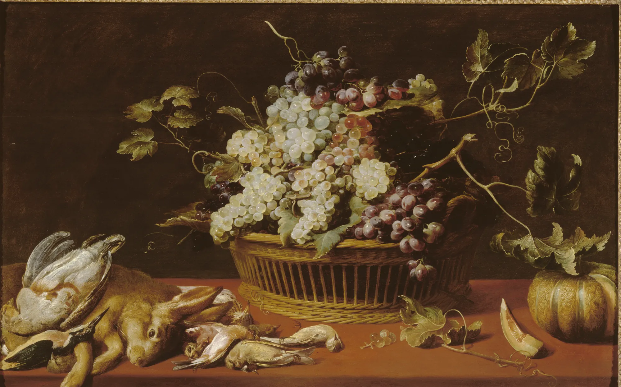 Still Life with Game and Fruit Still Life with Game and Fruit by Frans Snyders. A detailed Flemish still life featuring a central basket overflowing with white and purple grapes, flanked by a hunted hare and small birds on a red tablecloth.