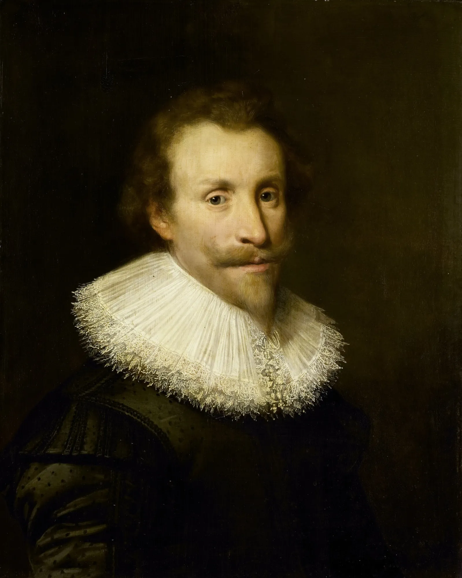Portrait of a Man Portrait of a Man by Jan van Ravesteyn. A bust-length portrait of a man with a mustache and goatee wearing an ornate white lace ruff and a dark patterned doublet.