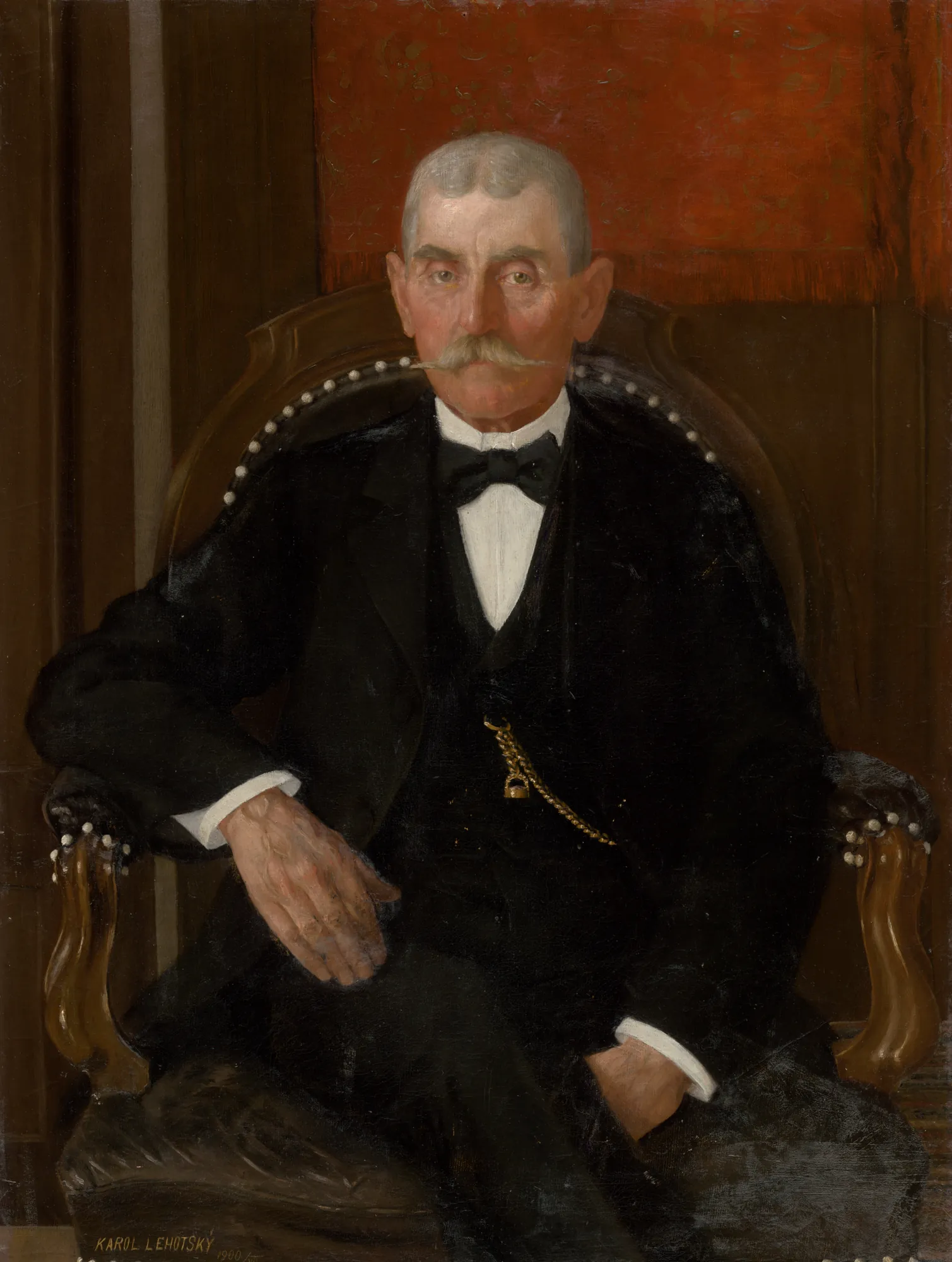 Portrait of Ján Danko Portrait of Ján Danko by Karol Miloslav Lehotský. A formal seated portrait of an elderly man with a white mustache wearing a black tuxedo and a gold watch chain against a patterned red background.