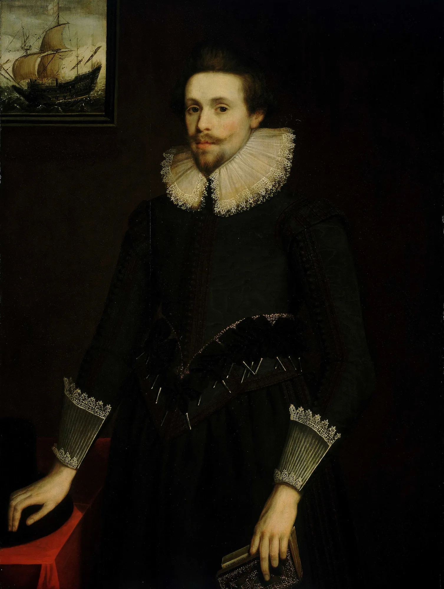 Portrait of a Naval Officer Portrait of a Naval Officer by Unknown Artist. A three-quarter length portrait of a young man in a black doublet with a large lace ruff and cuffs, standing against a dark background with a ship painting in the corner.