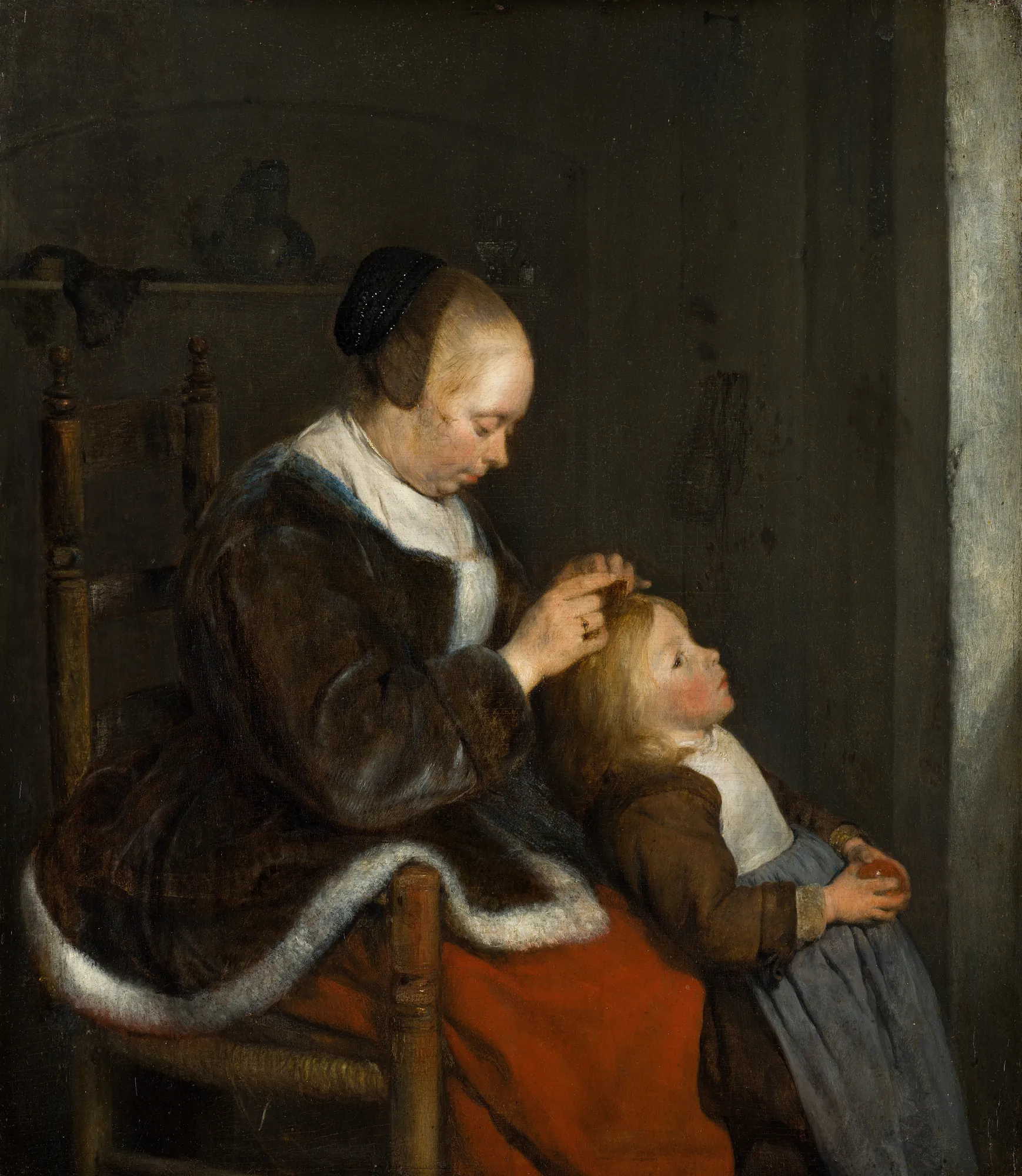 Mother Combing Her Child's Hair