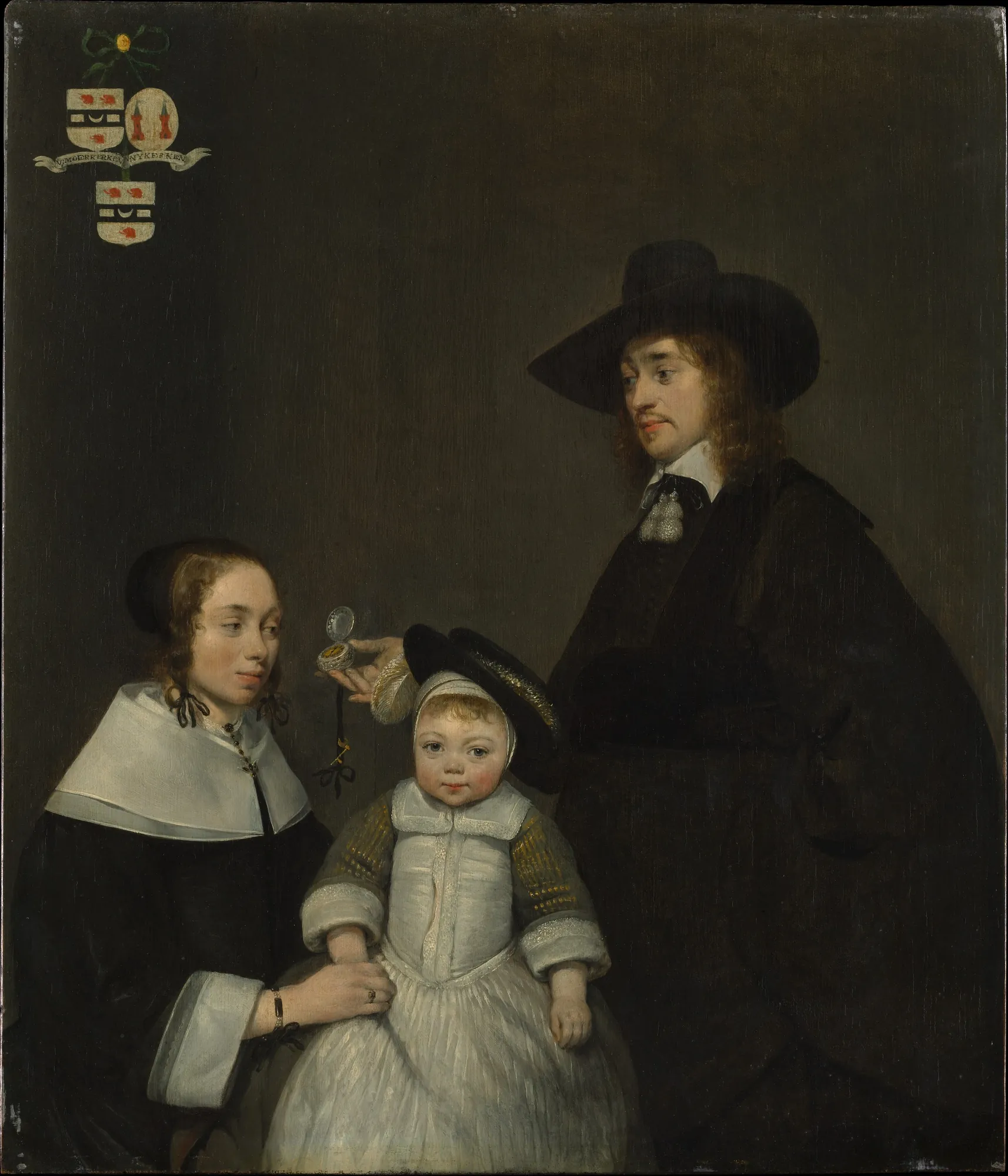 The Van Moerkerken Family The Van Moerkerken Family by Gerard ter Borch. A 17th-century formal portrait of a man, woman, and small child in black and white attire against a dark background, featuring a family crest.
