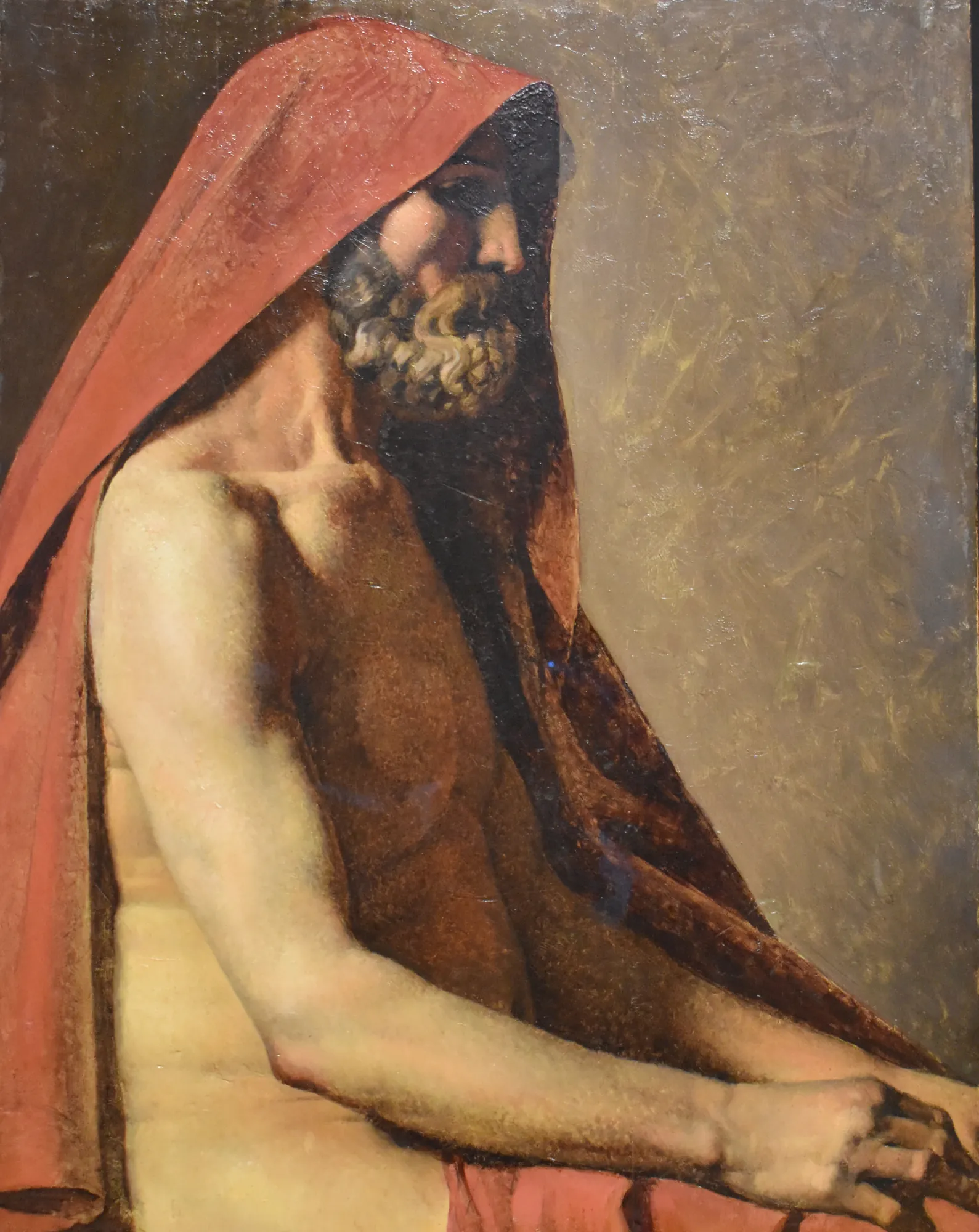 Study of a Seated Man in Profile Study of a Seated Man in Profile by Jean-Auguste-Dominique Ingres. An oil painting of a bearded man in profile, wearing a striking red hood draped over his head and shoulder.