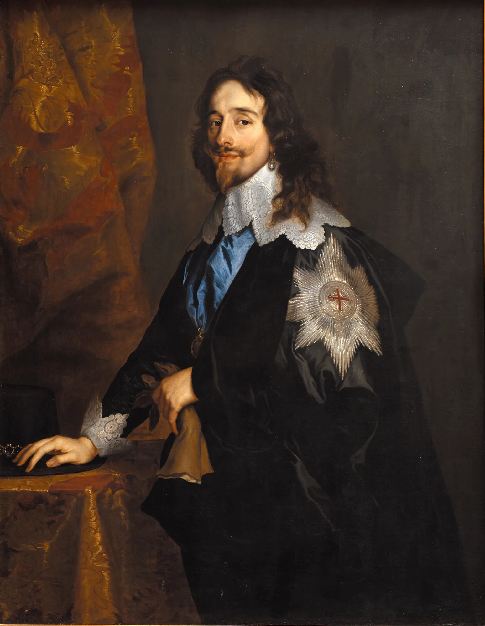 King Charles I of England King Charles I of England by Anthony van Dyck. A three-quarter length portrait of King Charles I wearing a black cloak with a silver Garter star and an intricate lace collar.