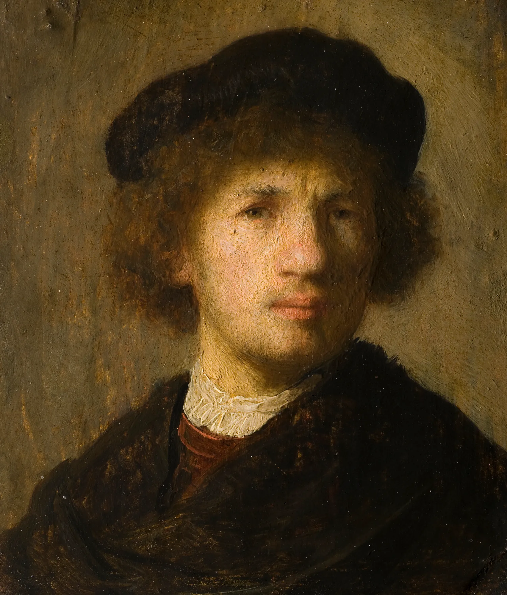 Self-Portrait Self-Portrait by Rembrandt. A close-up oil portrait of a young man with curly hair, wearing a black beret and a dark cloak, rendered with dramatic lighting.