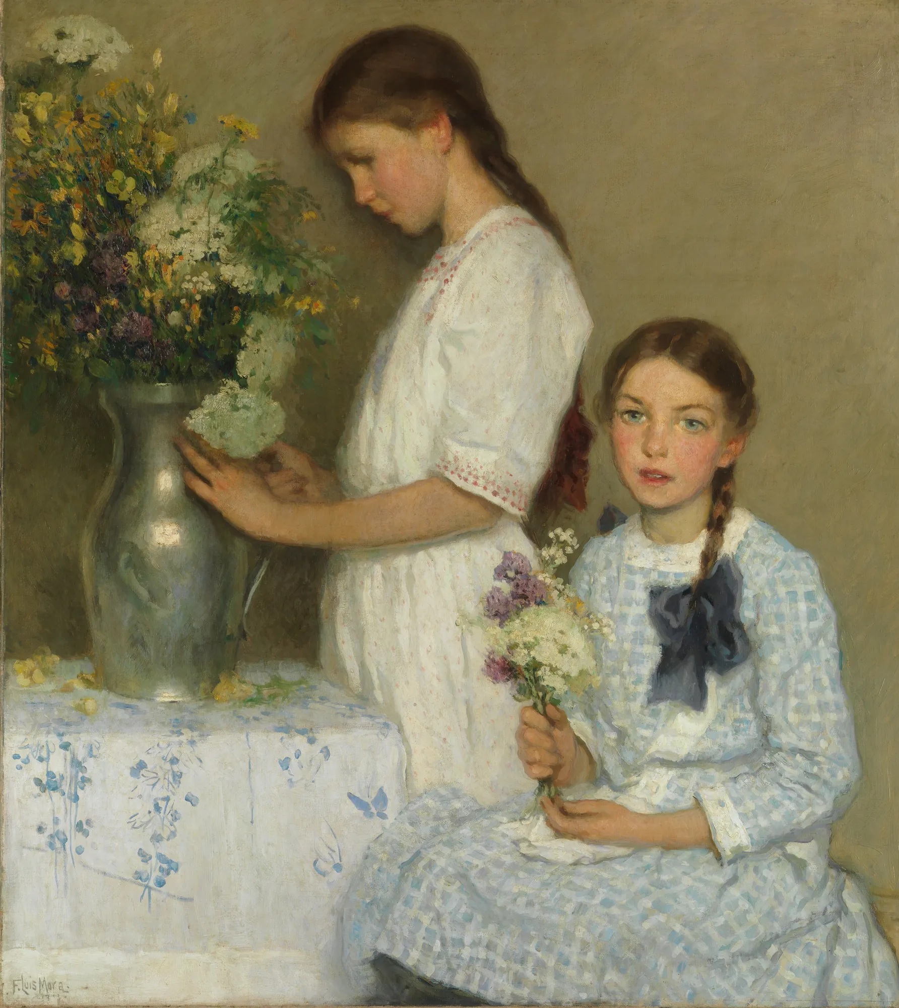 Flowers of the Field Flowers of the Field by F. Luis Mora. Two young girls are depicted in a soft-lit interior, one standing and arranging a large bouquet of wildflowers in a silver vase while the other sits holding a smaller bunch.