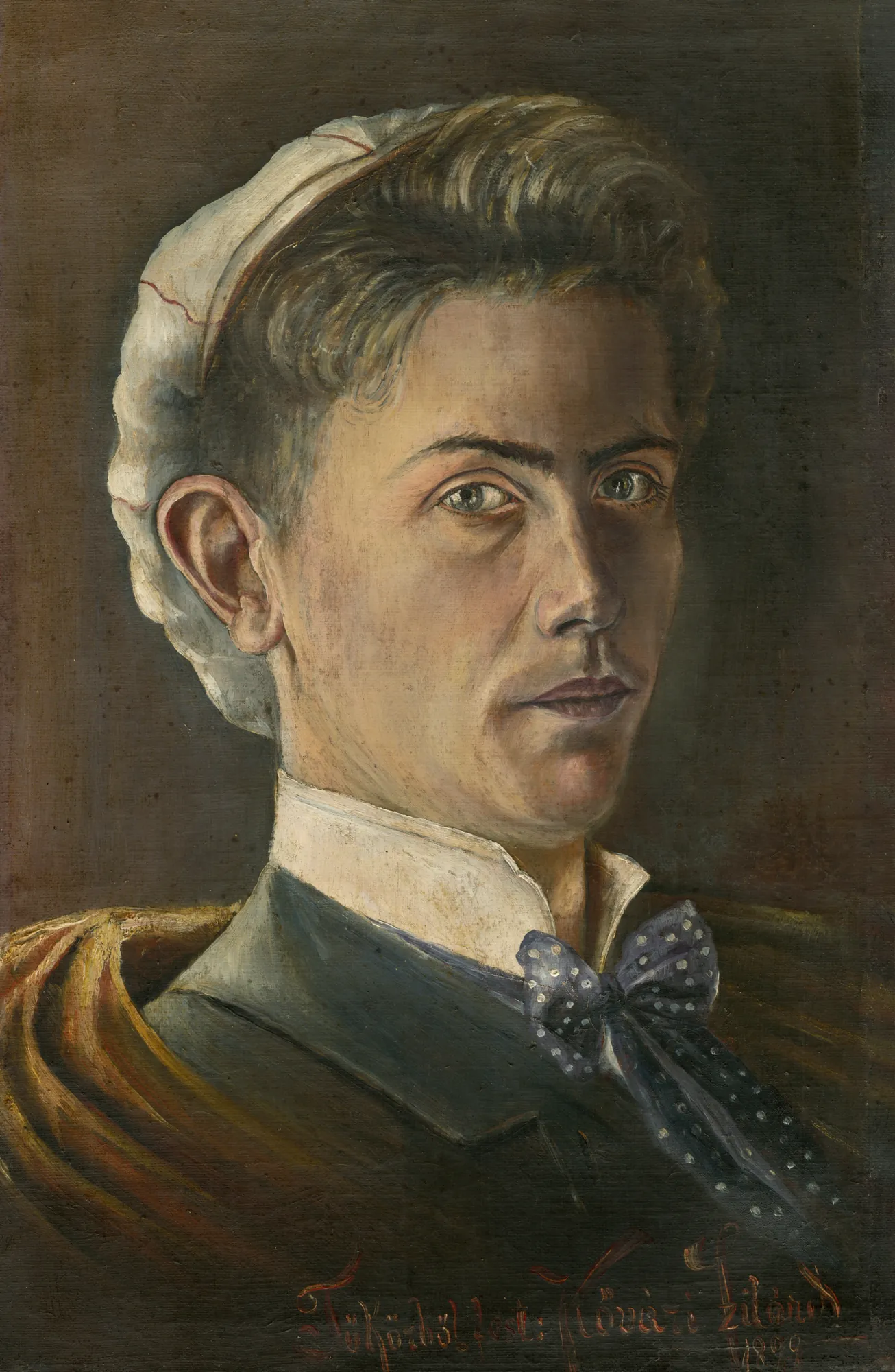 Self-Portrait Self-Portrait by Konštantín Kővári-Kačmarik. A close-up oil portrait of a young man with intense eyes wearing a white cap, a high collar, and a blue polka-dot bow tie.
