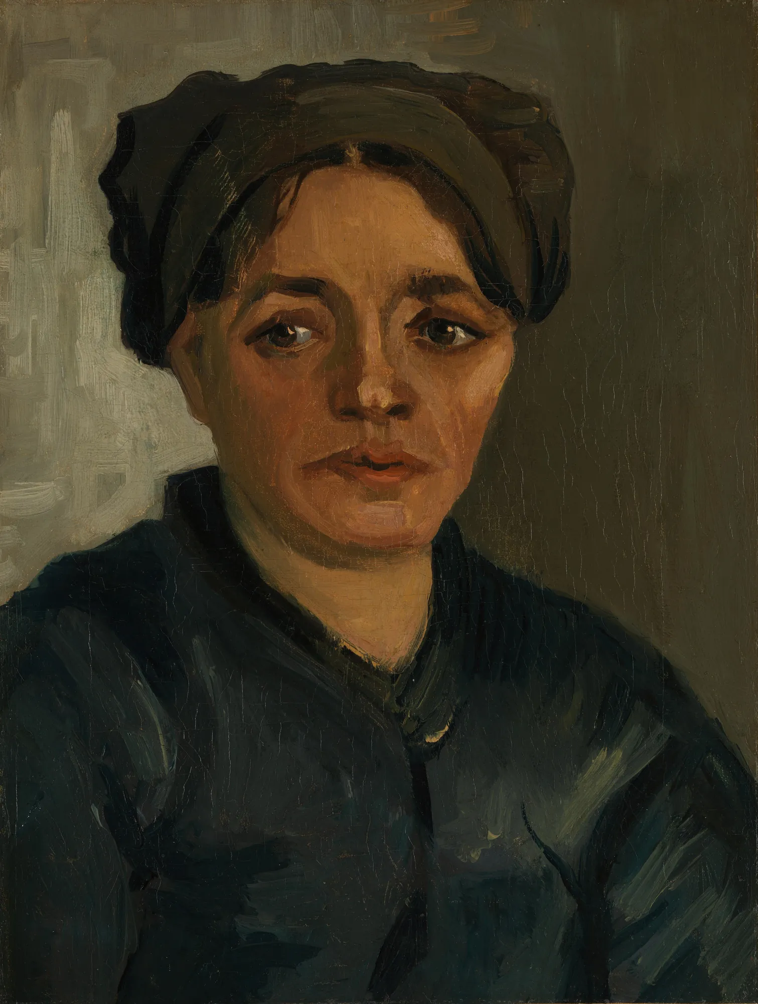 Head of a Peasant Woman Head of a Peasant Woman by Vincent van Gogh. A close-up portrait of a woman with a dark cap and deep, shadowed features, rendered in heavy brushstrokes and earthy tones.