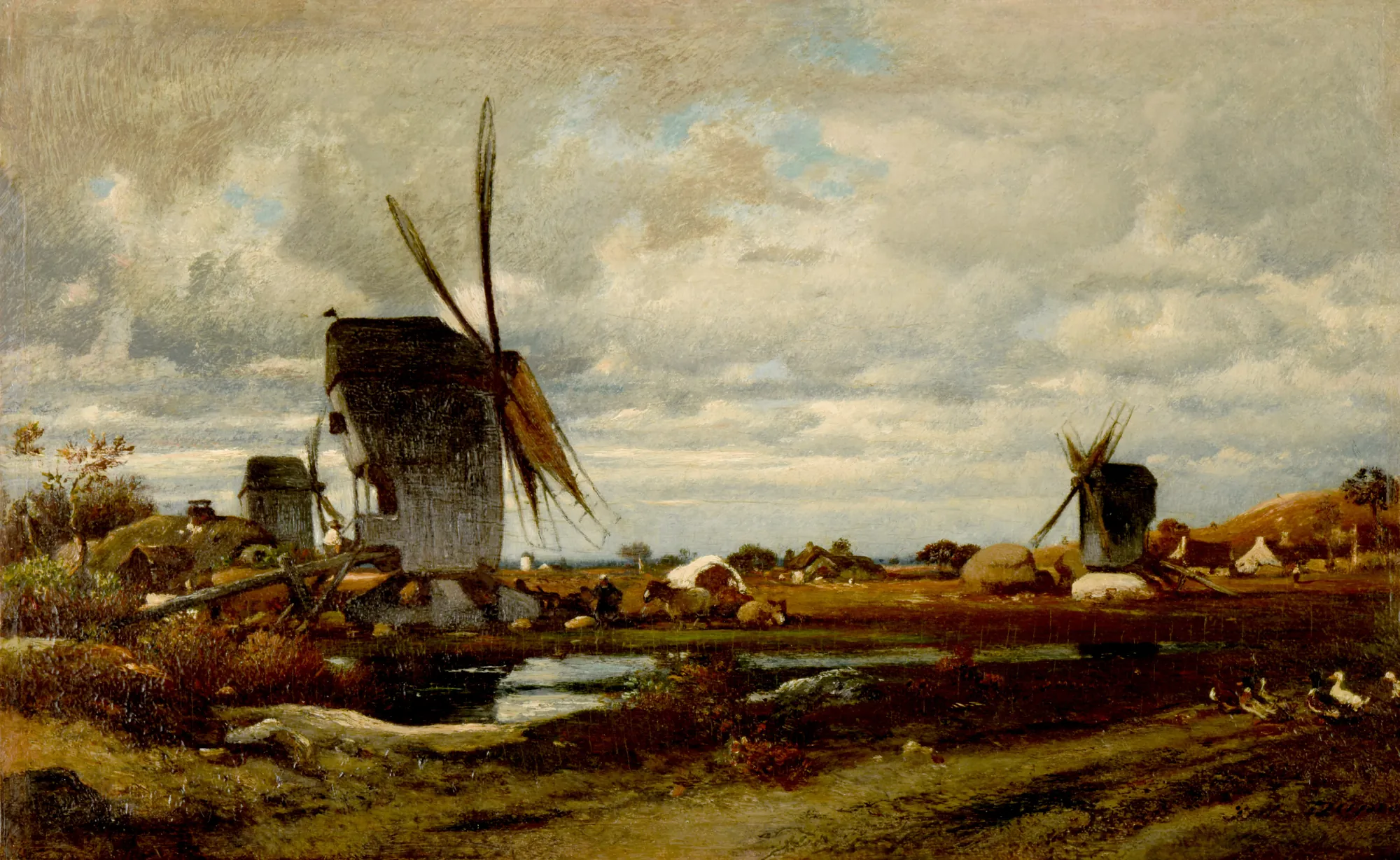 The Windmills (Les moulins à vent) The Windmills (Les moulins à vent) by Jules Dupré. An atmospheric landscape featuring two prominent windmills set against a vast, clouded sky above a rural plain with a small pond.