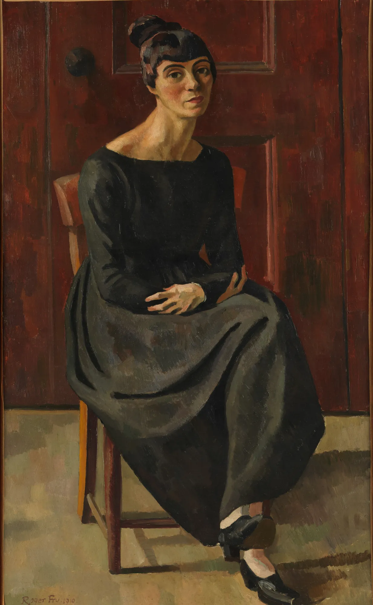 Gabrielle Soëne Gabrielle Soëne by Roger Fry. A woman in a long black dress is seated on a wooden chair before a large red paneled door.