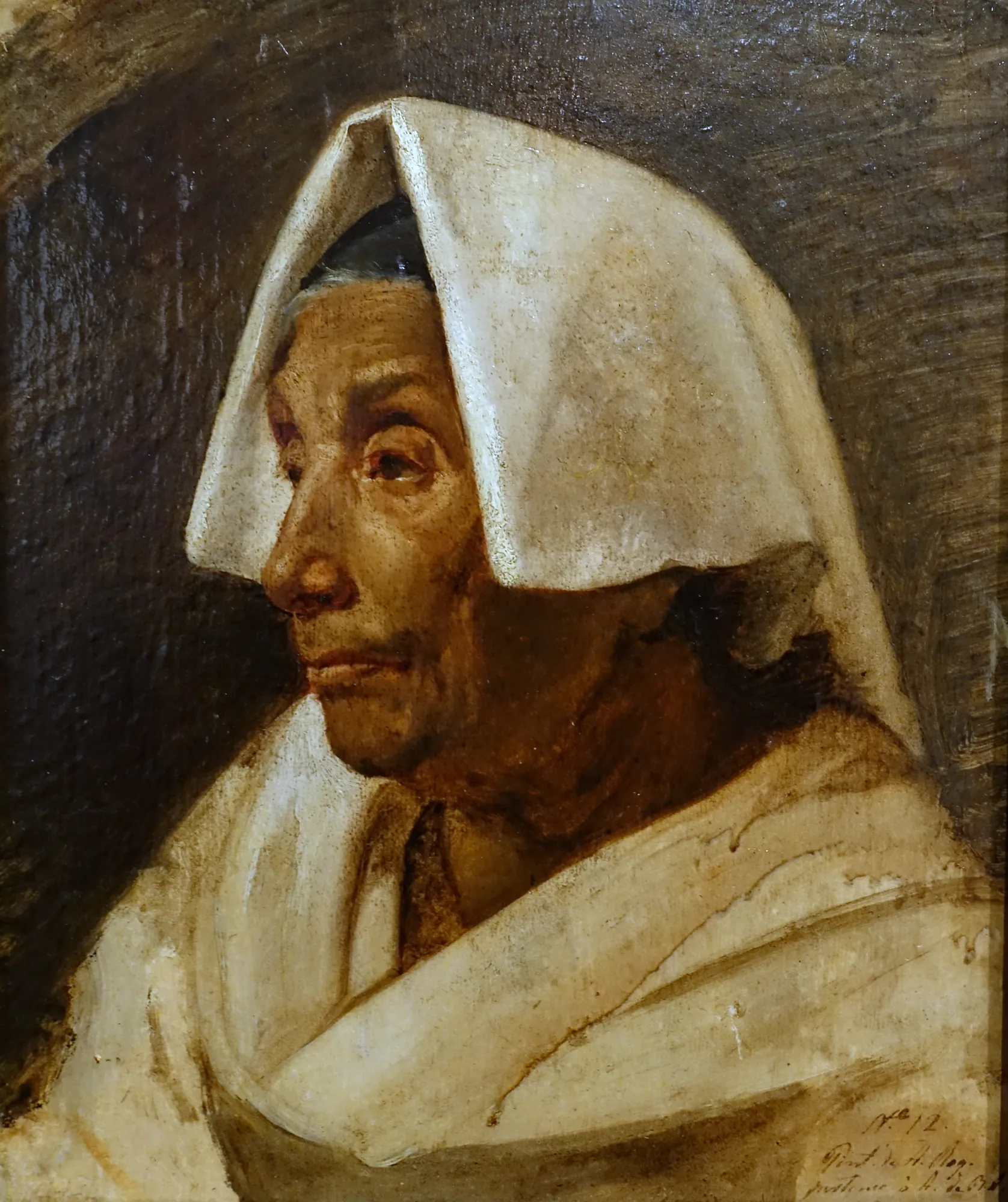 Head of an Old Woman Head of an Old Woman by Auguste Roquemont. A profile portrait of an elderly woman wearing a traditional white headscarf and shawl against a dark background.
