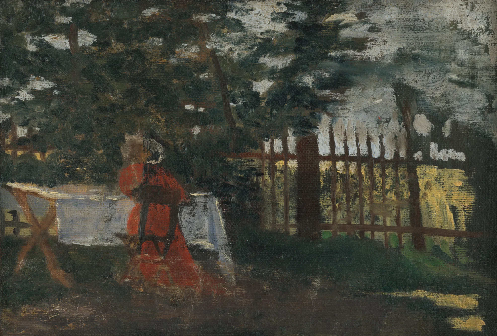 In the Garden In the Garden by Konštantín Kővári-Kačmarik. A figure in a vibrant red dress sits at a white-clothed table in a sun-dappled garden beside a wooden fence.