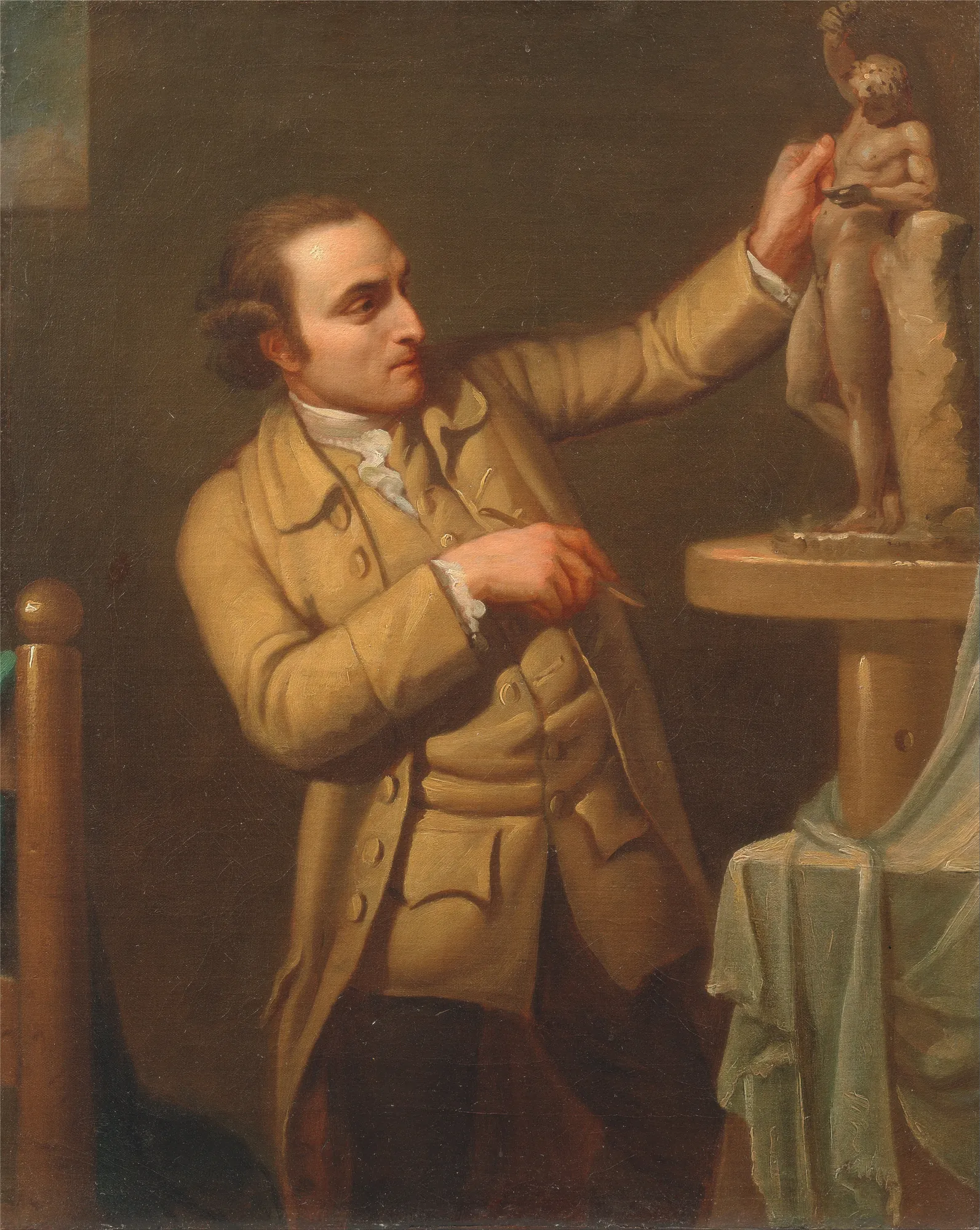 Joseph Nollekens Joseph Nollekens by David Allan. An 18th-century oil portrait of a man in a tan coat focusing intently on a small classical male sculpture.