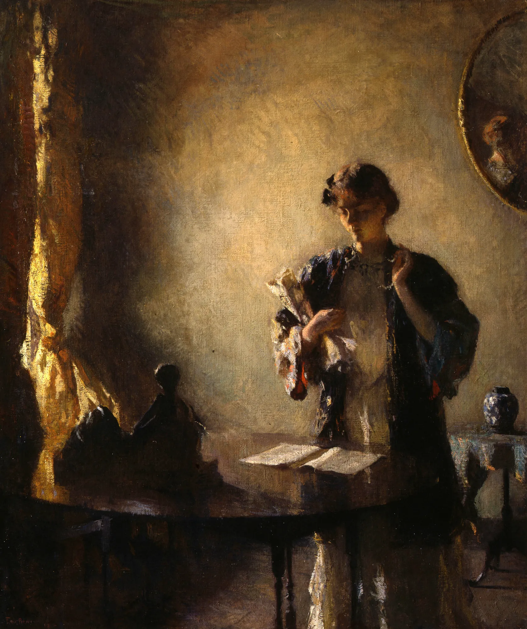 Figure in a Room Figure in a Room by Frank Weston Benson. A young woman stands beside a table in a dark room, her form illuminated by a warm, dramatic light source from the side as she looks down at an open book.