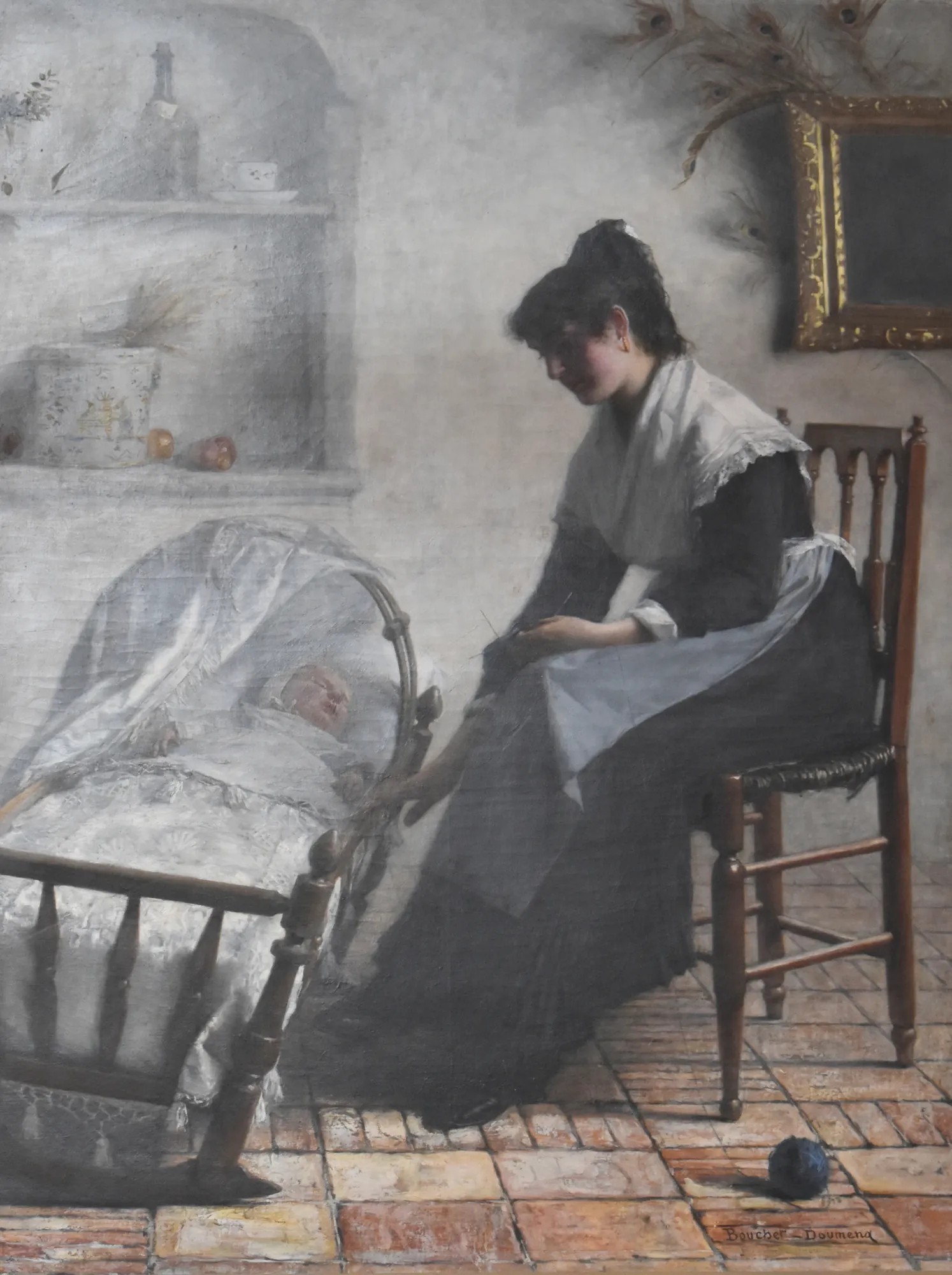 Jeune mère arlésienne Jeune mère arlésienne by Henri Bouchet-Doumenq. A young mother in traditional Arlesian costume sits in a simple interior, tending to a sleeping baby in a hooded wooden cradle.