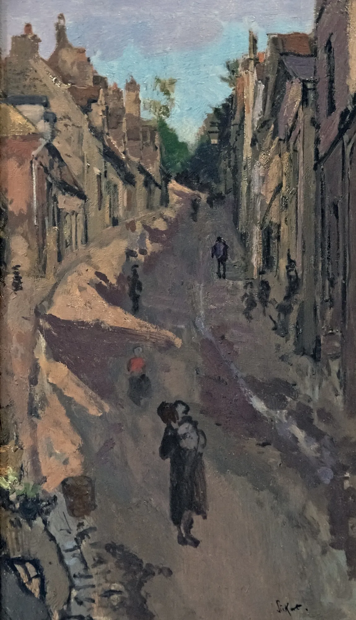 Le Mont de Neuville, Dieppe (Blue Sky) Le Mont de Neuville, Dieppe (Blue Sky) by Walter Sickert. A narrow, sun-dappled street in Dieppe lined with buildings, featuring several small figures walking away from the viewer.