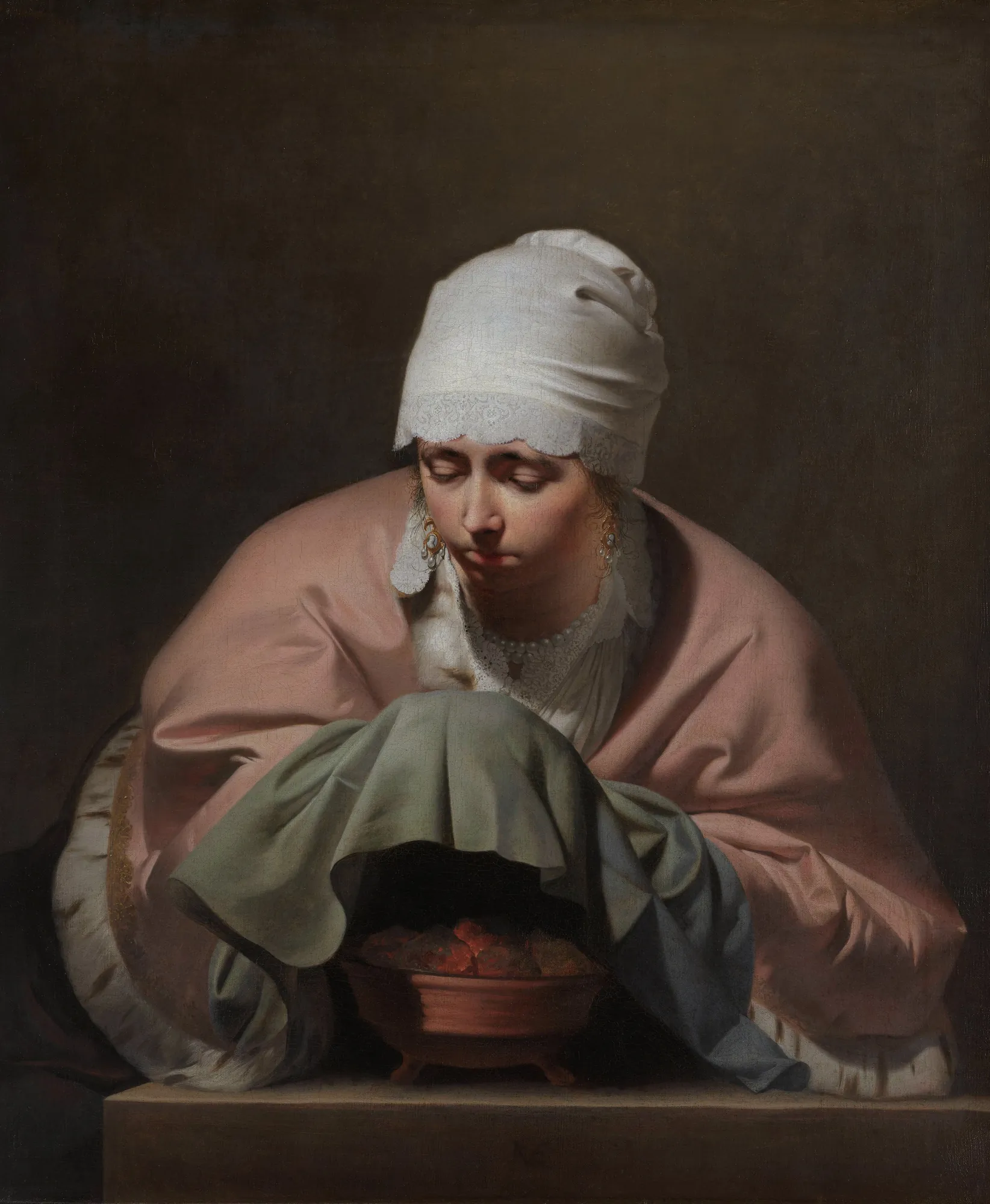 A Young Woman Warming her Hands