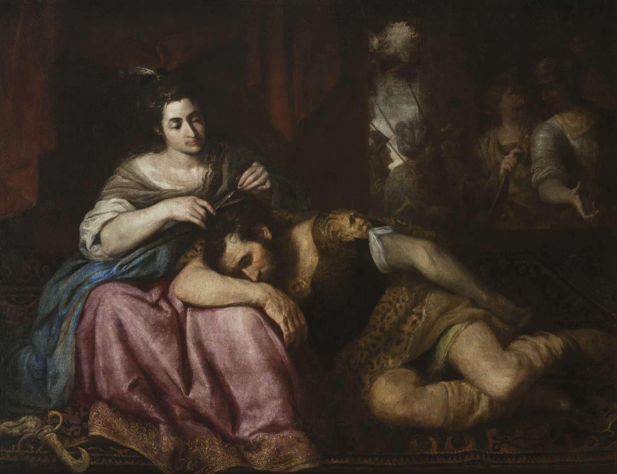 Samson and Delilah Samson and Delilah by Luciano Borzone. A woman in a pink and blue gown quietly cuts the hair of a sleeping man resting in her lap, while soldiers watch from the shadows.