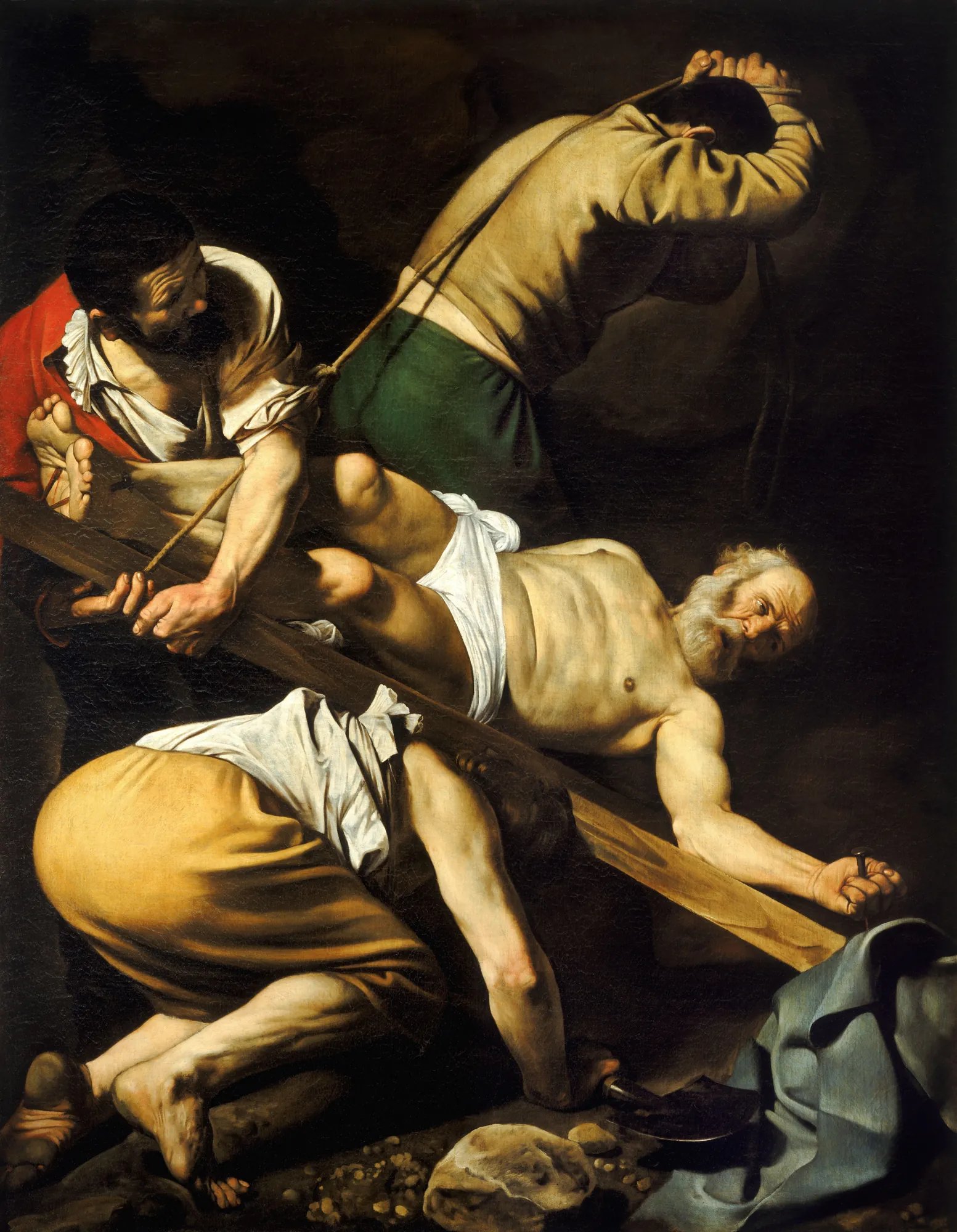 Crucifixion of Saint Peter Crucifixion of Saint Peter by Caravaggio. Three executioners struggle to lift a wooden cross to which an elderly, bearded man is nailed upside down against a dark, shadowy background.