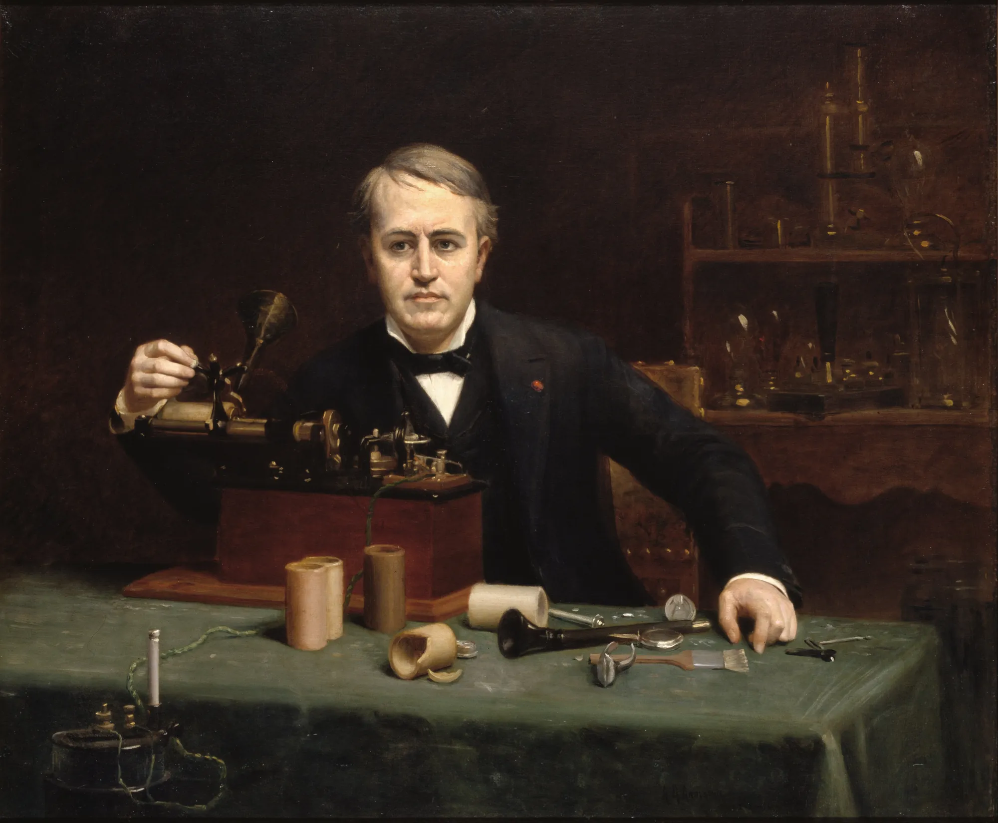 Thomas Alva Edison Thomas Alva Edison by Abraham Archibald Anderson. A seated portrait of Thomas Edison at a table filled with scientific equipment and phonograph cylinders.