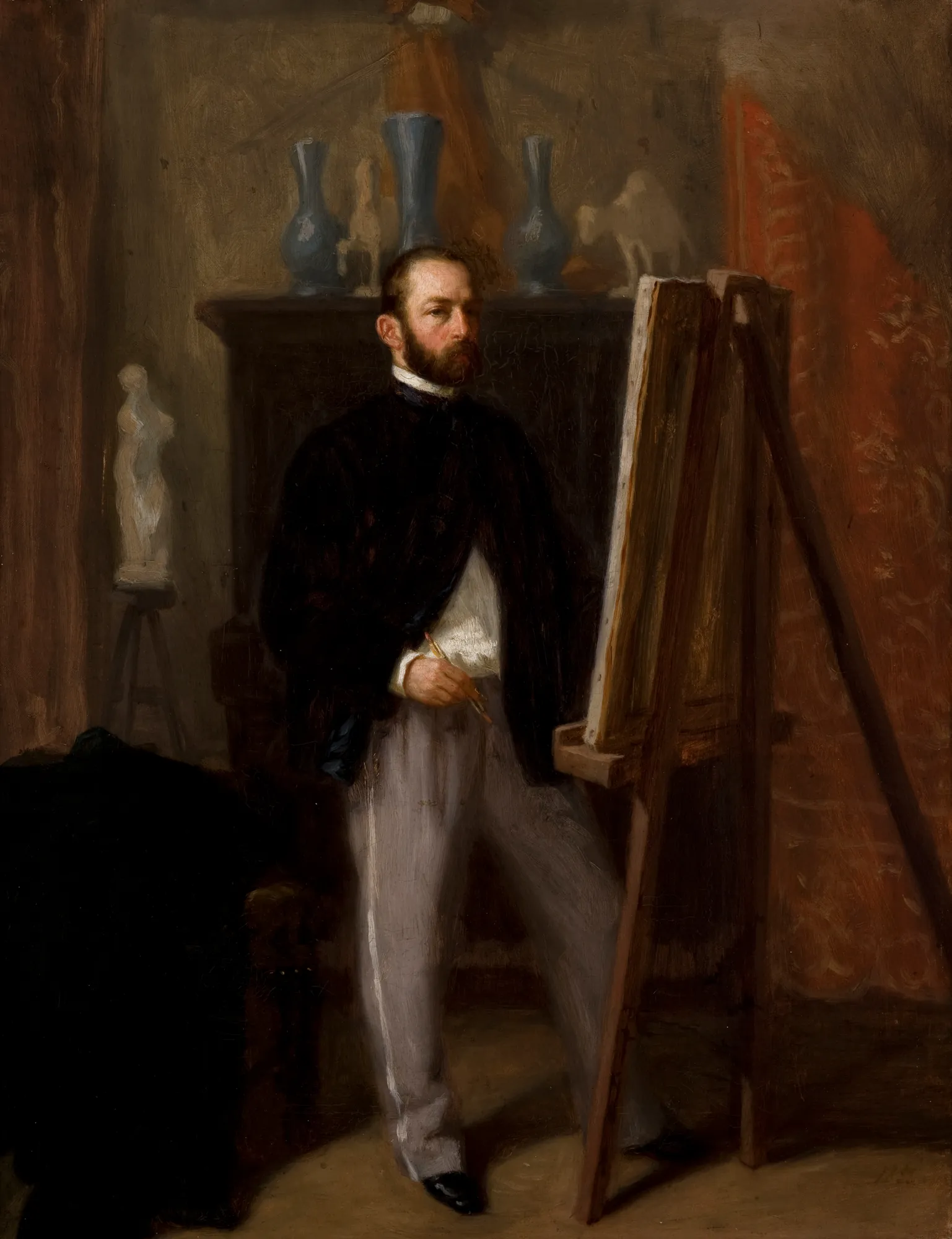 Self-Portrait at the Easel Self-Portrait at the Easel by Henryk Rodakowski. A bearded man in mid-19th-century attire stands before a wooden easel in an artist's studio, holding a palette and brush.