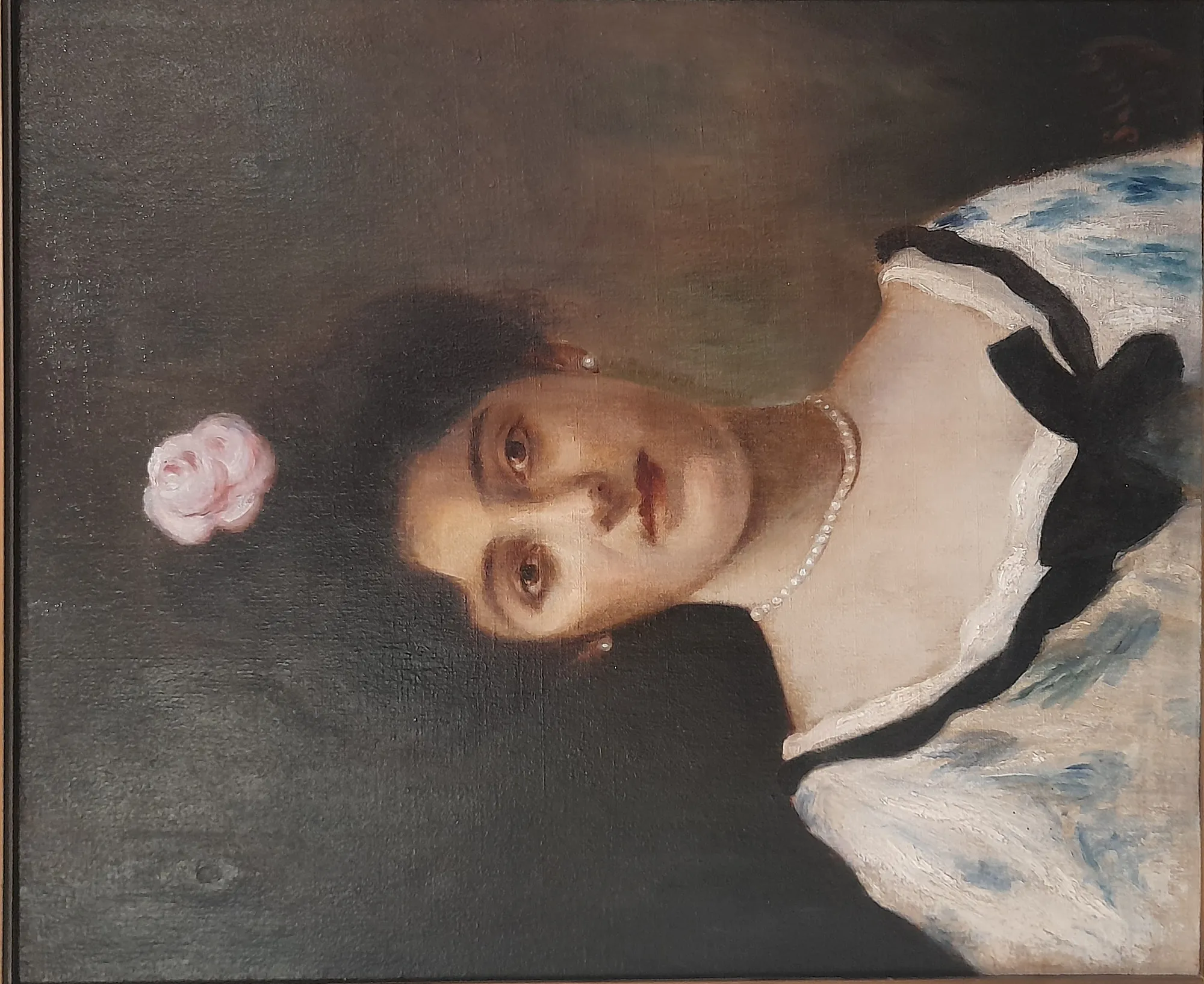 Lady with a Rose Lady with a Rose by Khalil Saleeby. A refined oil portrait of a woman with a pink rose in her dark hair, wearing a white dress with black trim and a pearl necklace.