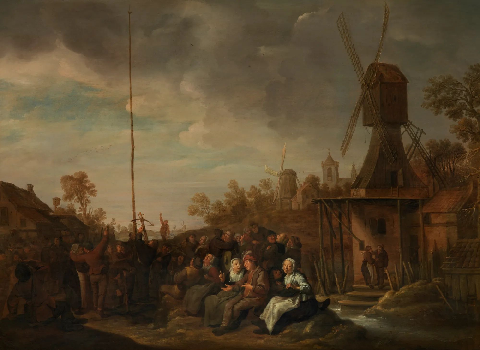 Shoot for a Prize Shoot for a Prize by Jan Miense Molenaer. A bustling 17th-century Dutch village scene featuring a crowd gathered for a contest near a tall pole and a large windmill under a cloudy sky.